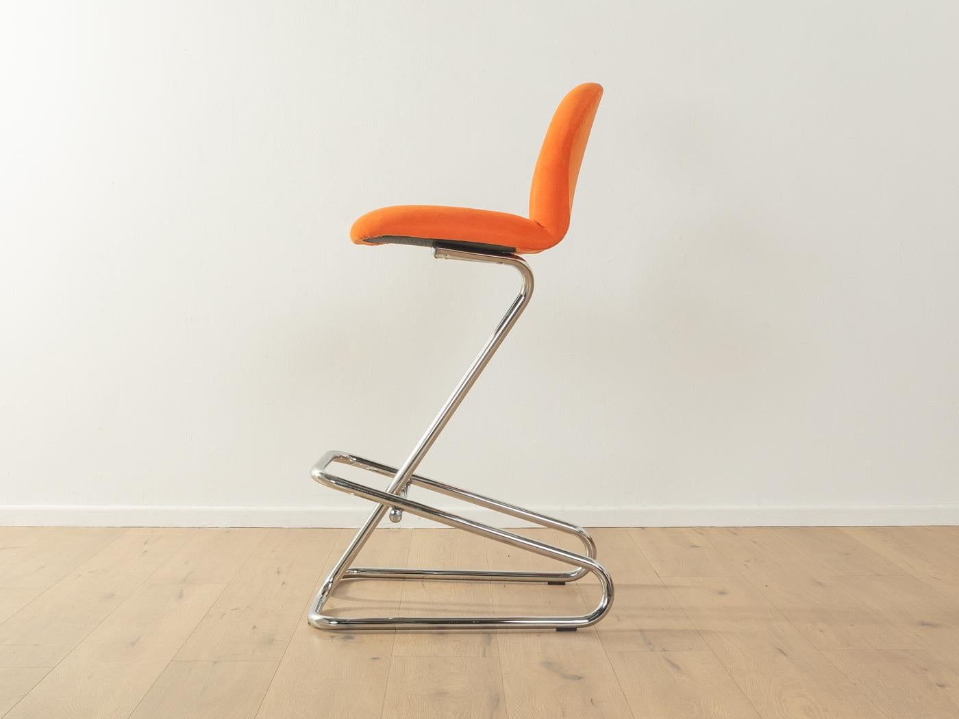 Space age bar stools from the 1970s. High-quality frame made of chromed stainless steel. The seats have been reupholstered and covered with a high-quality fabric in orange. The offer includes 3 bar stools.

Quality Features:
very good
