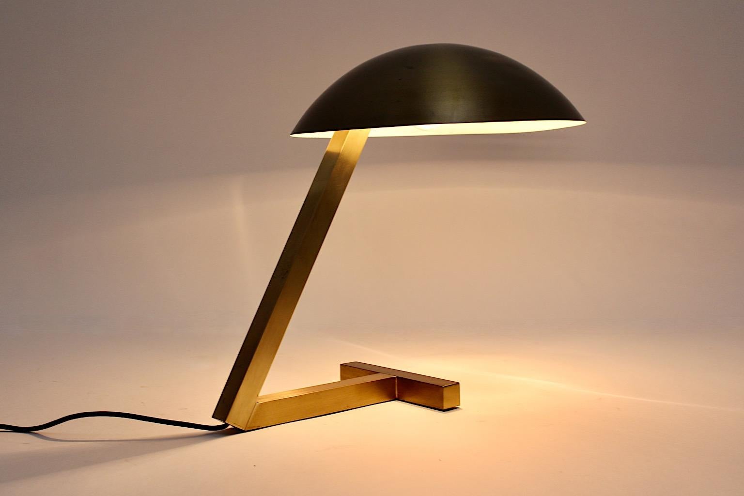 Space Age vintage dome table lamp or desk lamp from brass 1960s Italy.
An amazing table lamp from brass with dome shade and geometric base worked in a beautiful golden color.
The geometrical shape from the base stands in contrast to the round