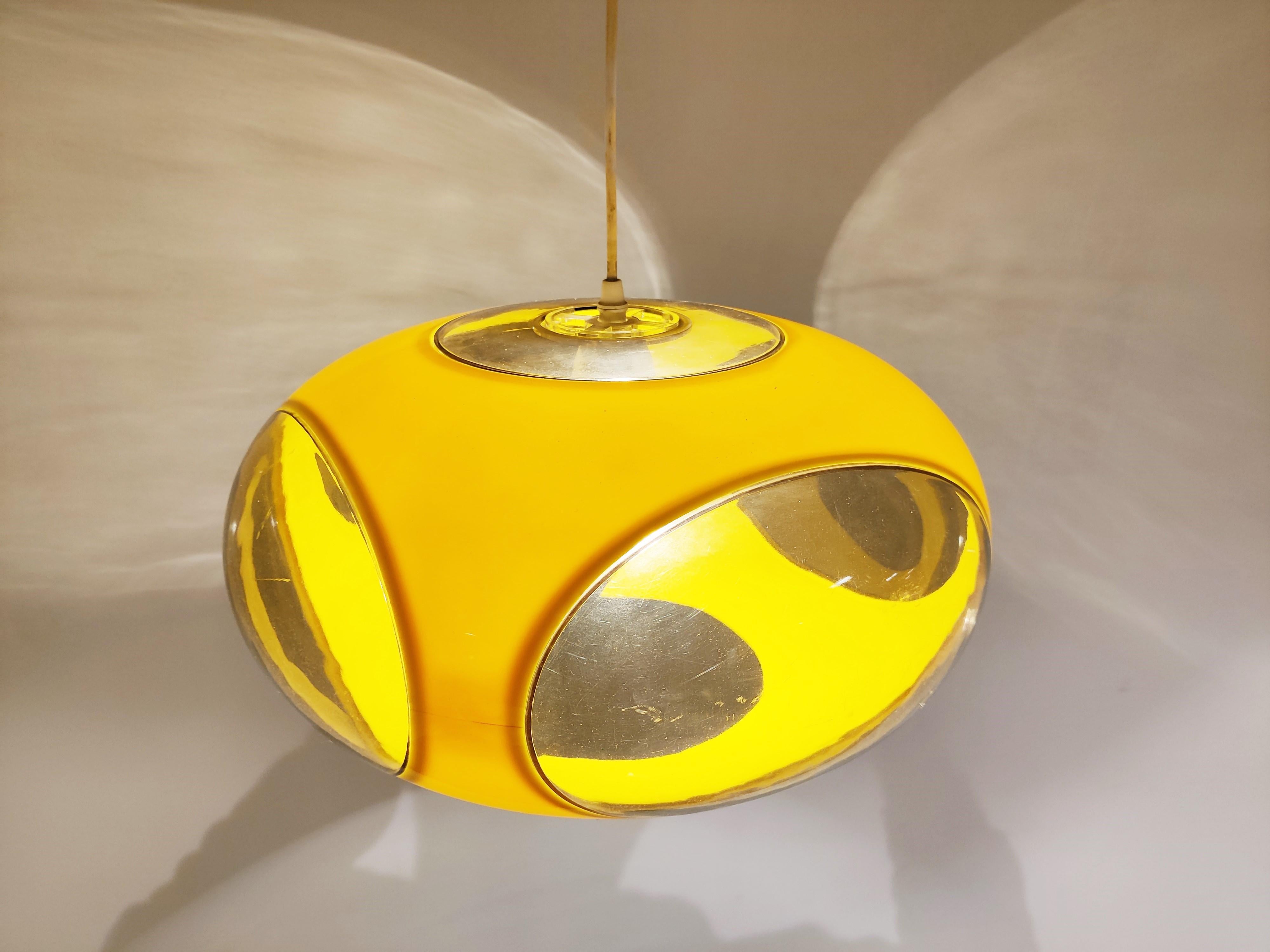 Mid century space age 'bug eye' or ufo pendant light by Massive.

The lamp is mostly referred to as Luigi Colani design but is not correct. These where produced in Belgium by a lighting company called Massive.

Nevertheless it is a great