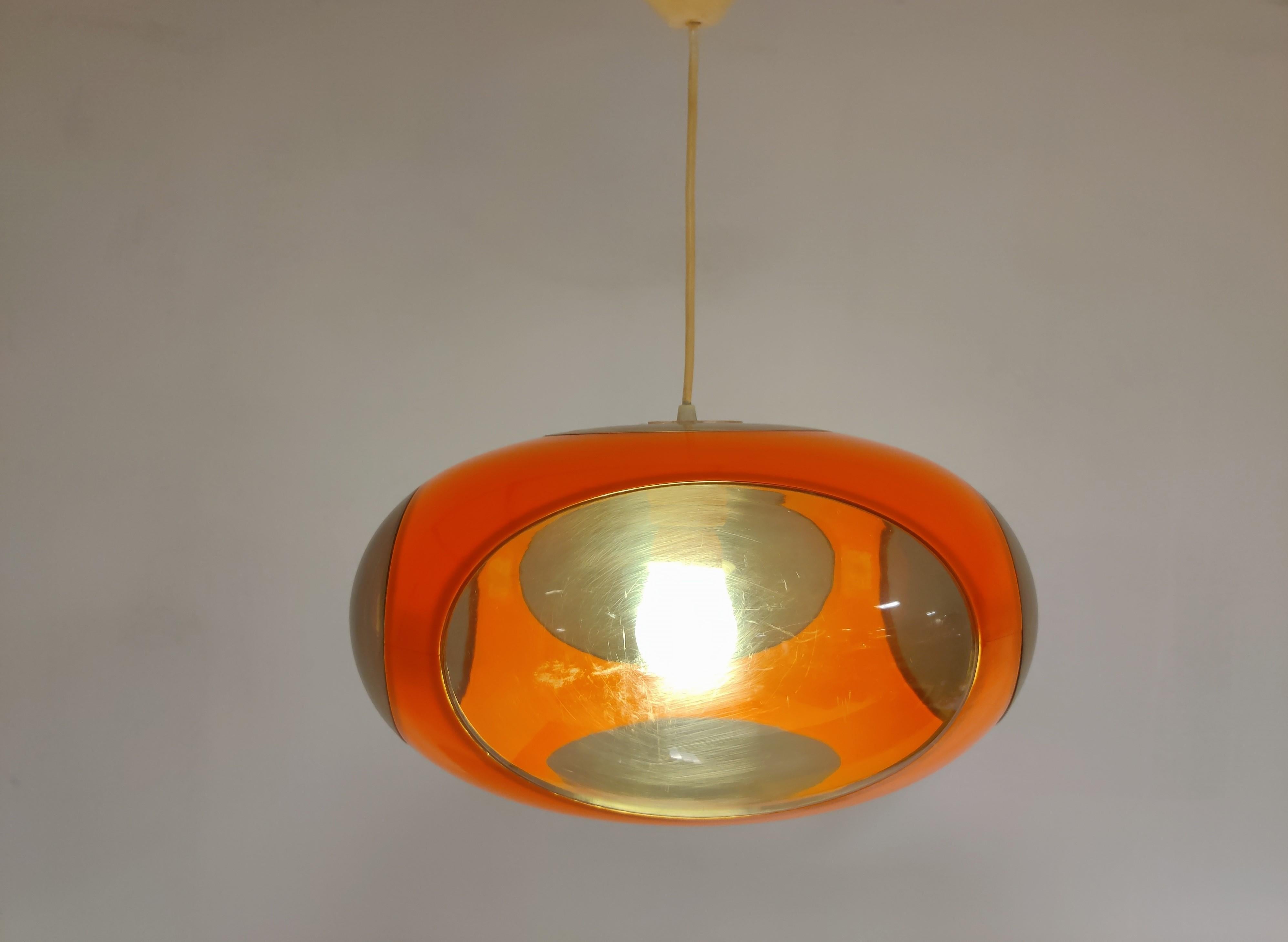 Midcentury Space Age 'bug eye' or ufo pendant light by Massive.

The lamp is mostly referred to as Luigi Colani design but is not correct. These where produced in Belgium by a lighting company called Massive.

Nevertheless it is a great original