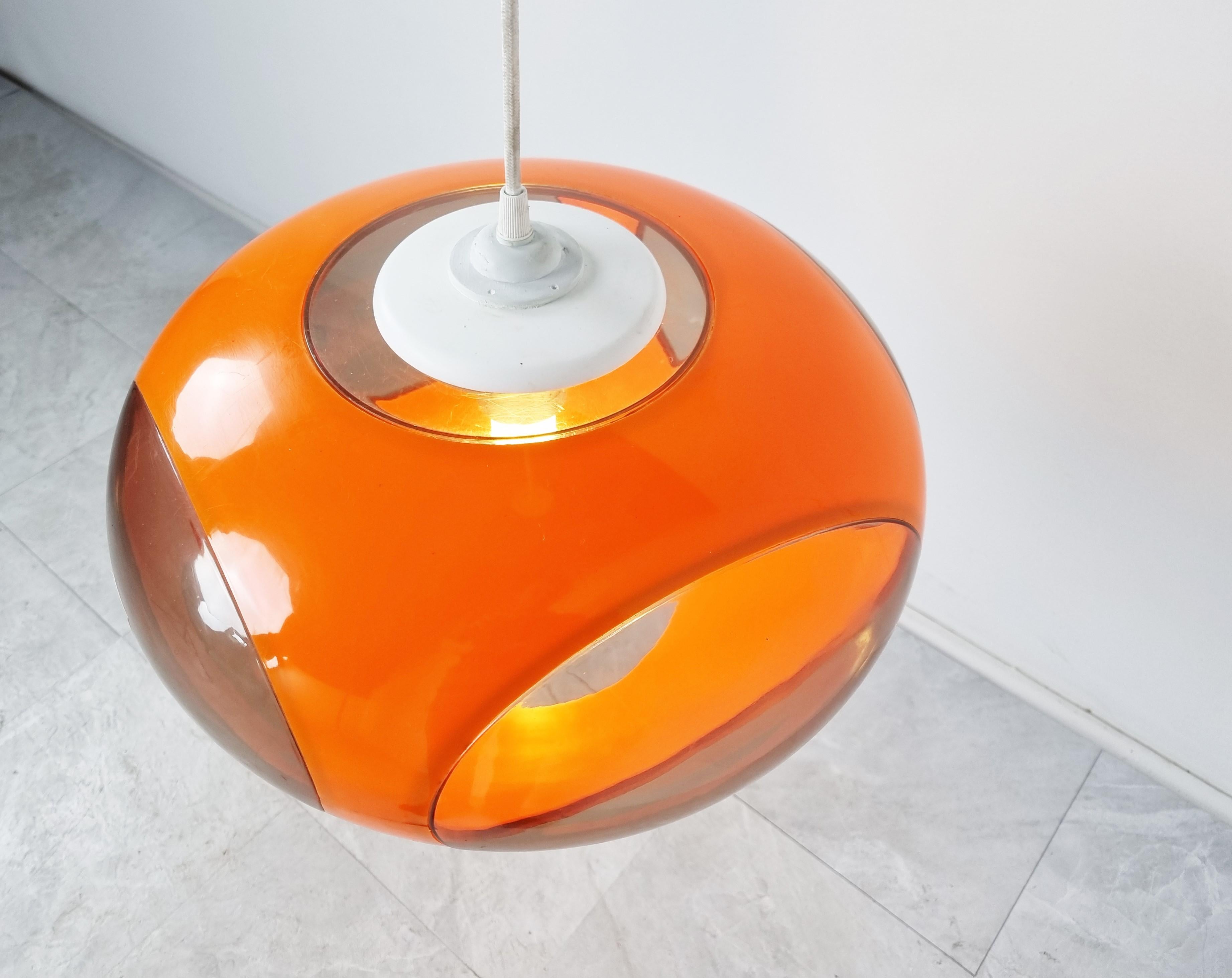 Mid century space age 'bug eye' or ufo pendant light by Massive.

The lamp is mostly referred to as Luigi Colani design but is not correct. These where produced in Belgium by a lighting company called Massive.

Nevertheless it is a great original