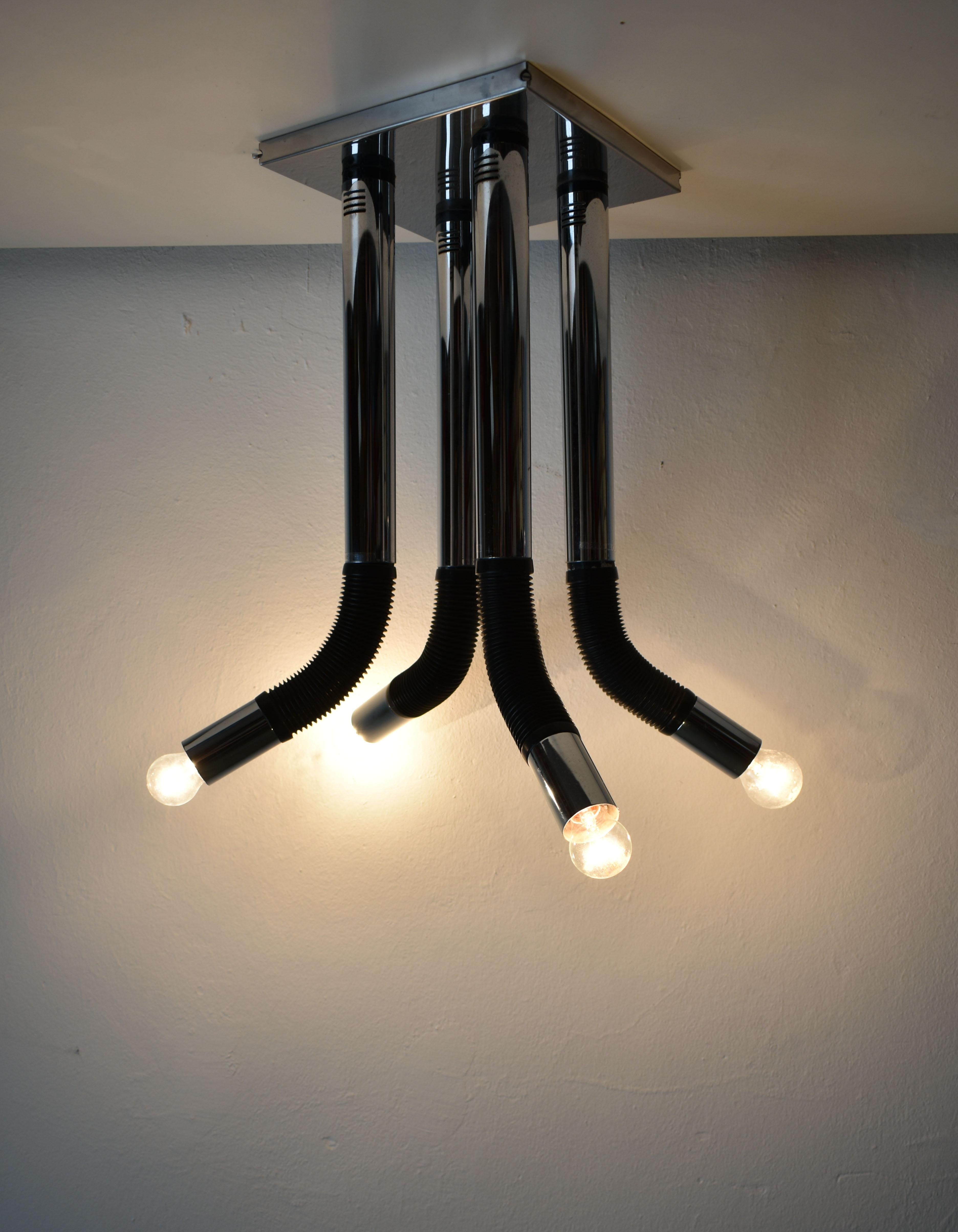 Vintage chandelier with 4 lights, model 'Elbow' designed by Mario Bellini for Italian company Targetti Sankey

Produced in the 1970s and 1980s

Model 'Elbow' was produced in few versions, like a desk lamp, clamp lamp, floor lamp and so on. The