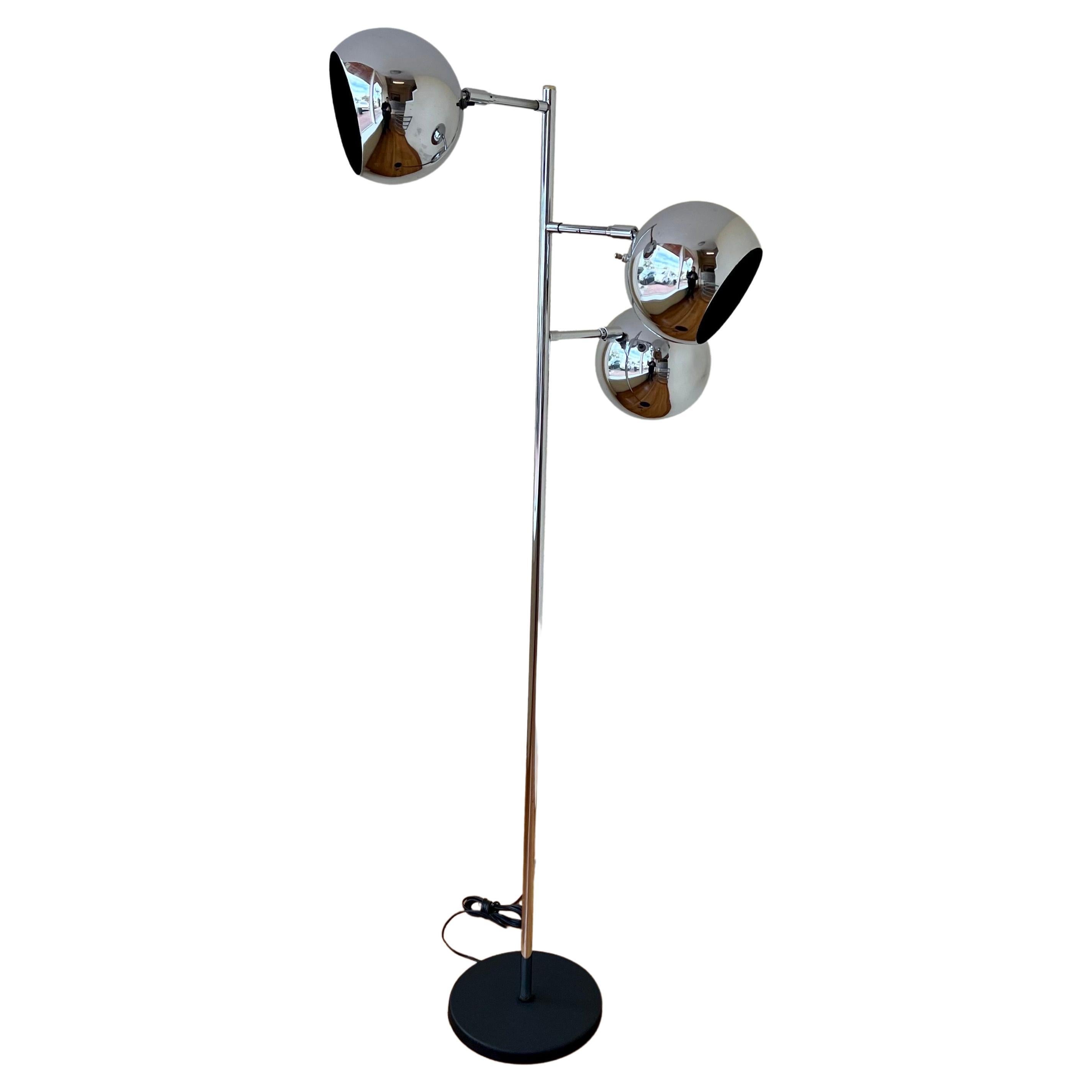 A very rare chrome triple globe multidirectional floor lamp by, Robert Sonneman, freshly rewired and polished, the base shows some light rust due to age and the globes move side to side and up and down, has a black enameled finish.


  