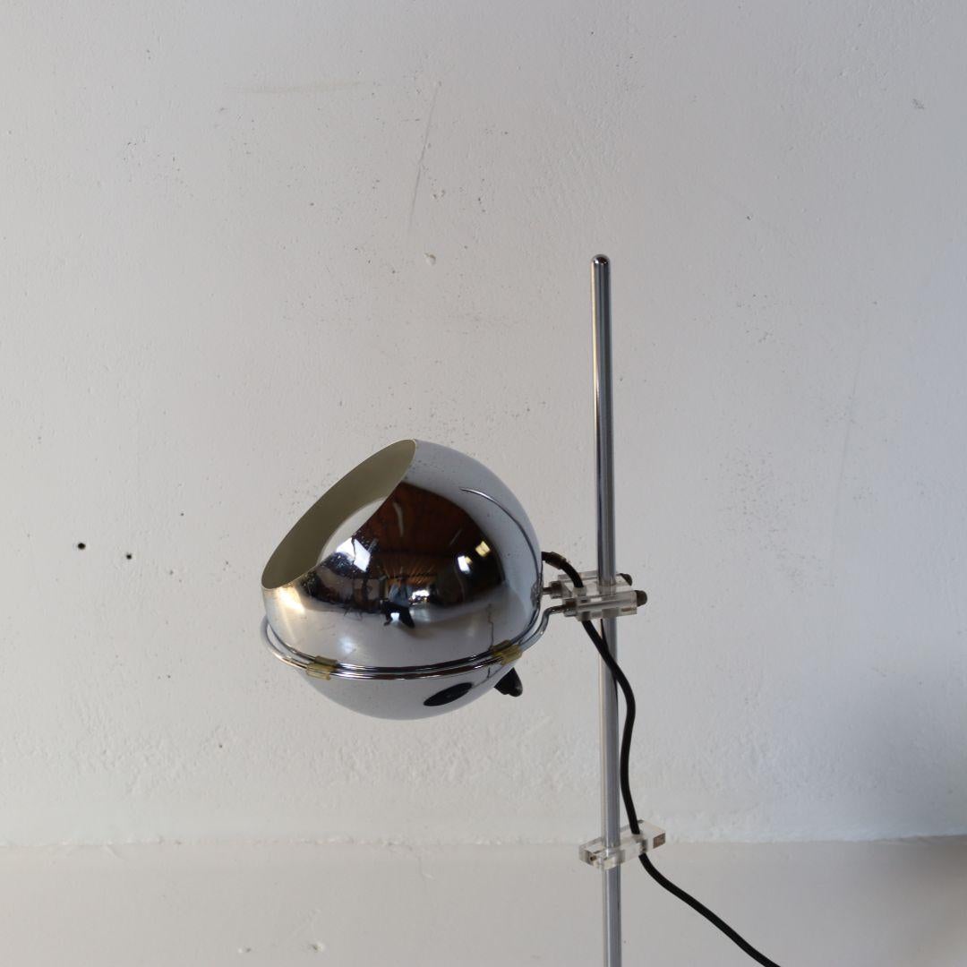 A rather rare Mid Century Modern table lamp from Artimeta, Netherlands from the 1970s. The 'sphere' rests (loosely) on a chrome-plated metal frame that stands firmly on its base. The lamp is adjustable in all directions thanks to a clever mechanism.