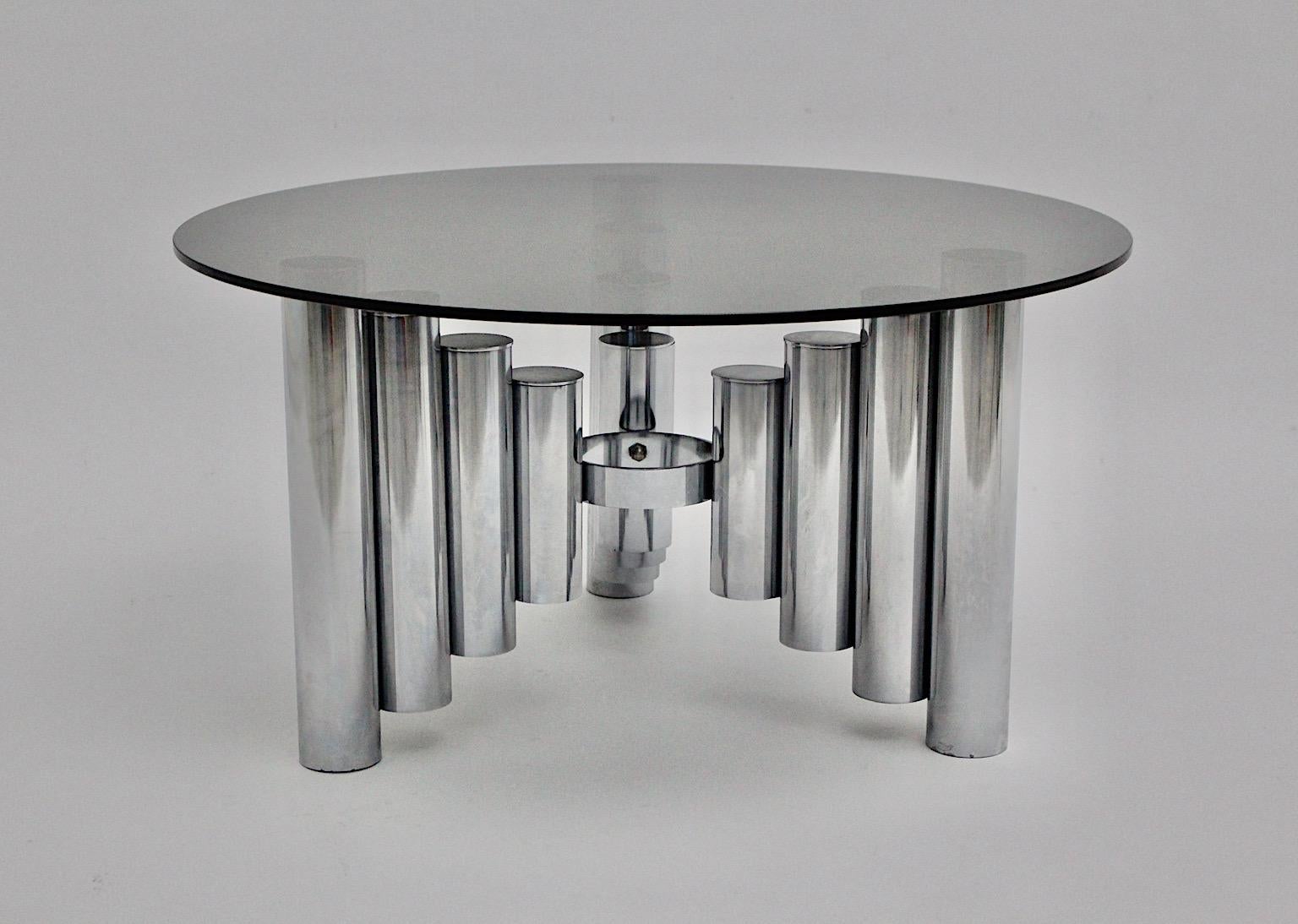 Space Age vintage coffee table from chromed base and glass plate in sculptural shape 1960s.
Beautiful coffee table circa 1960 featuring a chromed metal base with 12 tubes lined up in various sizes.
Very good condition with signs of age.
approx.