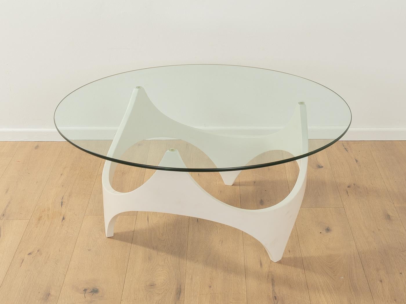 Opal Möbel space age coffee table from the 1970s. High-quality white lacquered wooden frame with a glass tabletop.

Quality Features:

    very good workmanship
    high-quality materials
    Made in Germany, Manufacturer: Opal Möbel