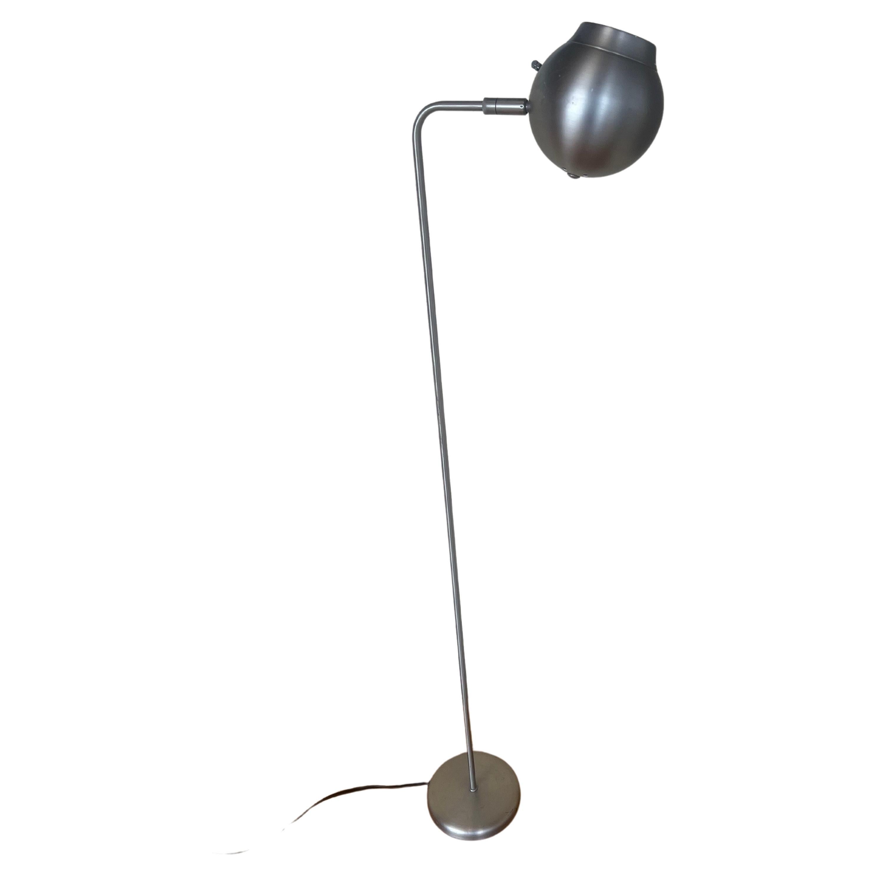 Space age brushed steel finish , multidirectional head floor lamp great for reading goes perfect with mid century , postmodern space age decor.