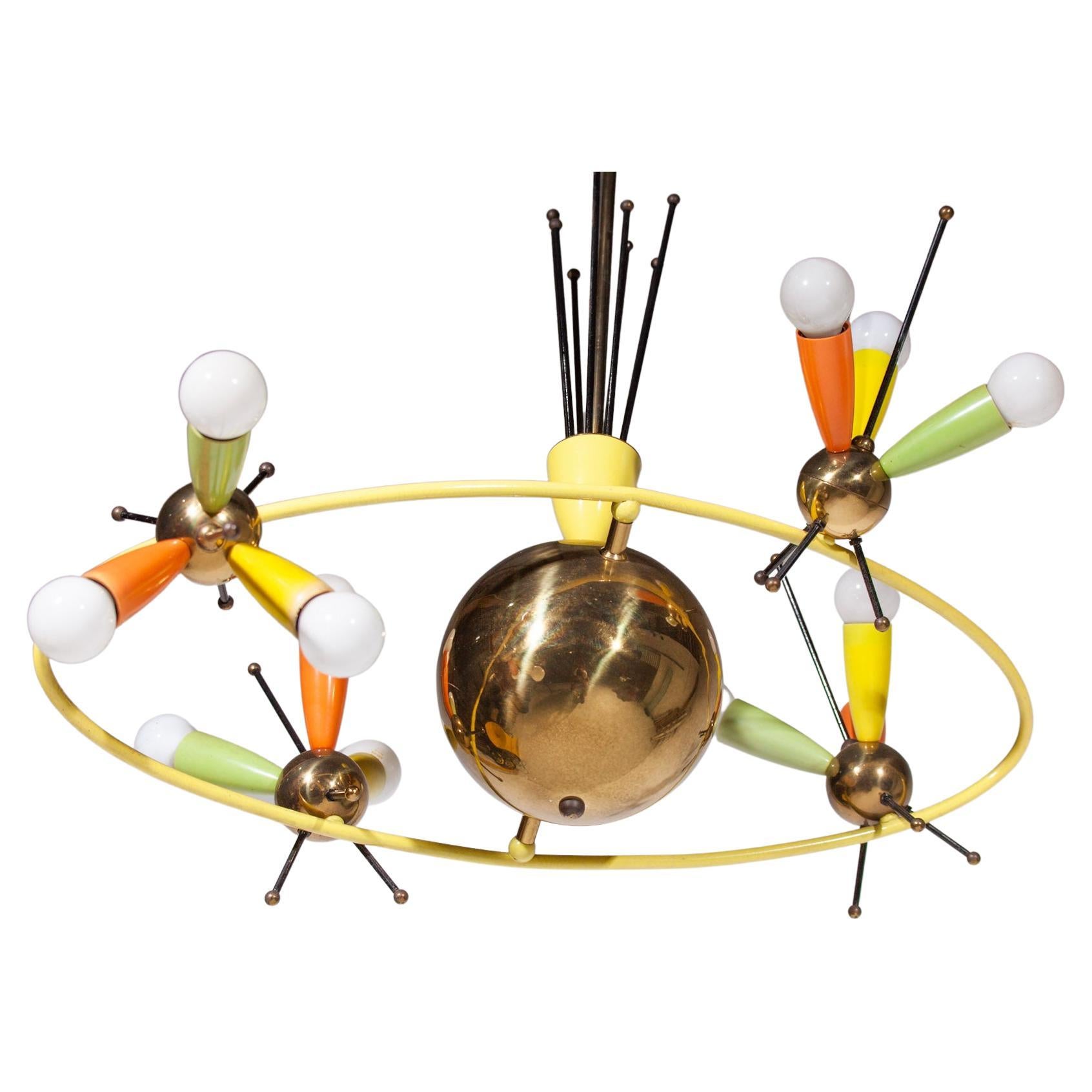 Rare authentic brass Spage Age Sputnik chandelier in style of Angelo Lelli, Italy, 1957. The eclips around the suggested planet with a rotating set of three star lights in the colors yellow, orange and green gives a real space effect especially when