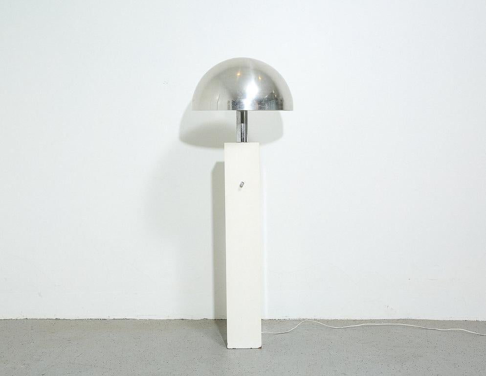 Vintage Space Age floor lamp. Large spun aluminum dome shade over a high-gloss white lacquer plinth. Dimmable.