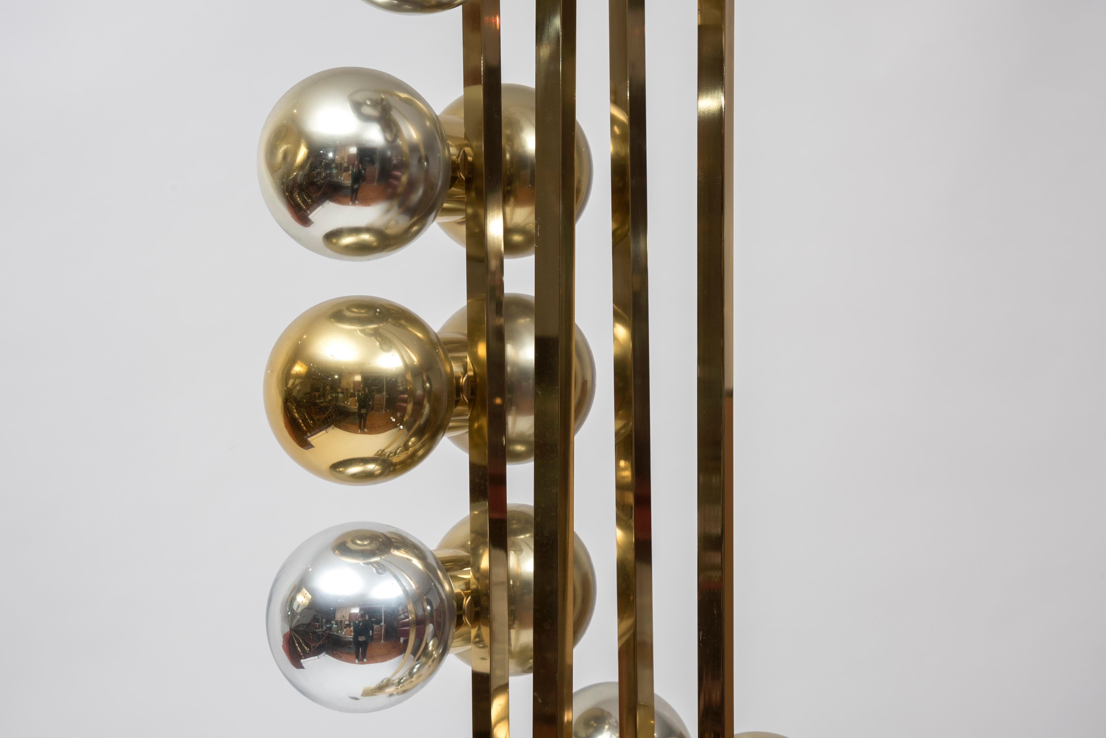 Space age floor lamp in brass with mercury ball glass,
circa 1980s
France

