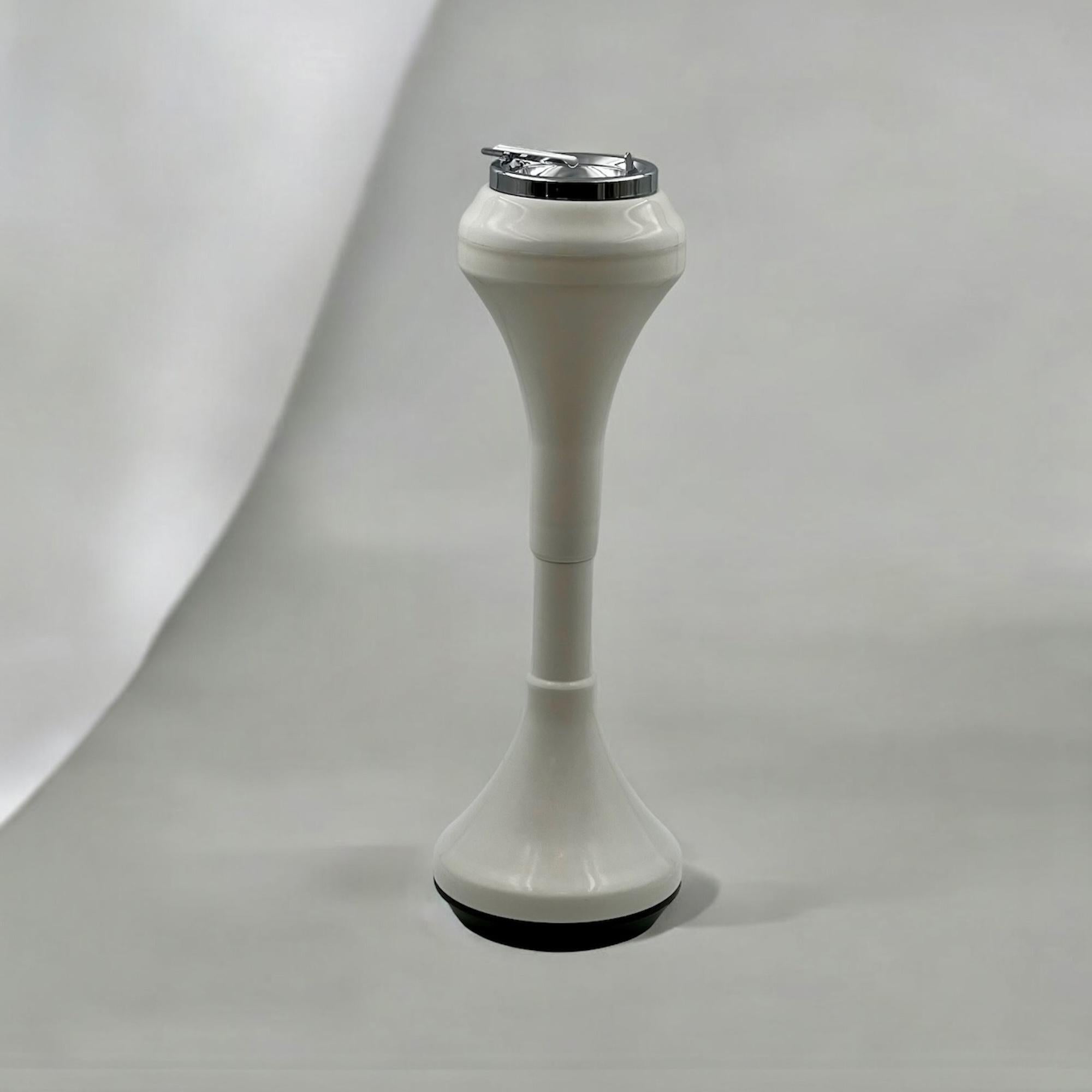 Indulge in the nostalgia of space age design with our exquisite Italian floor standing ashtray from the 1960s. Crafted with a sleek plastic silhouette in a timeless white hue, this ashtray seamlessly embodies the futuristic elegance of the space age