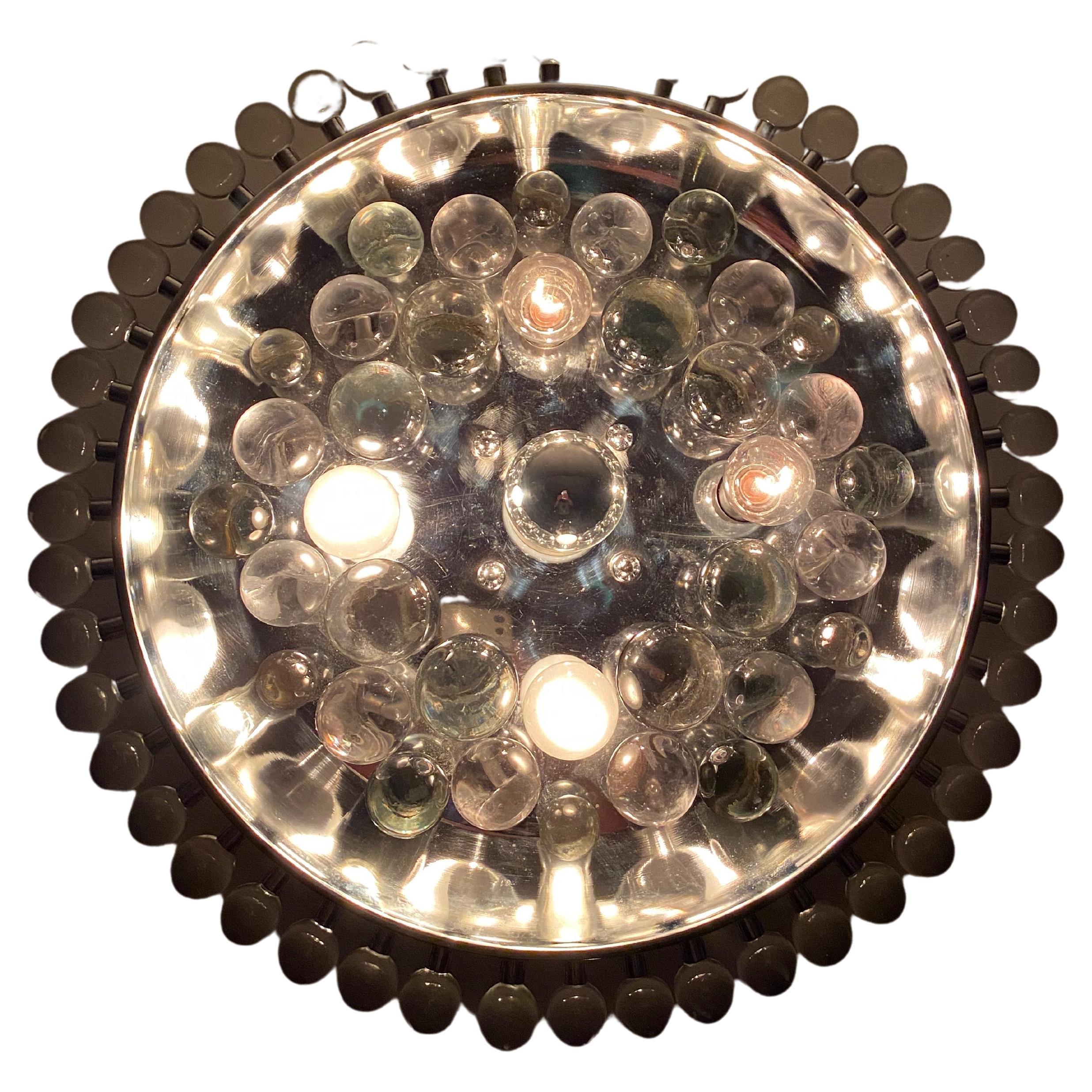 Large Space Age flush mount or wall light.
Manufactured in Italy during the 1960’s in chromed metal and glass spheres in a shape reminiscent of a flying saucer. 
This lamp was most likely produced by Sciolari or Stilkronen.
Takes 4 E14 and 1 E27