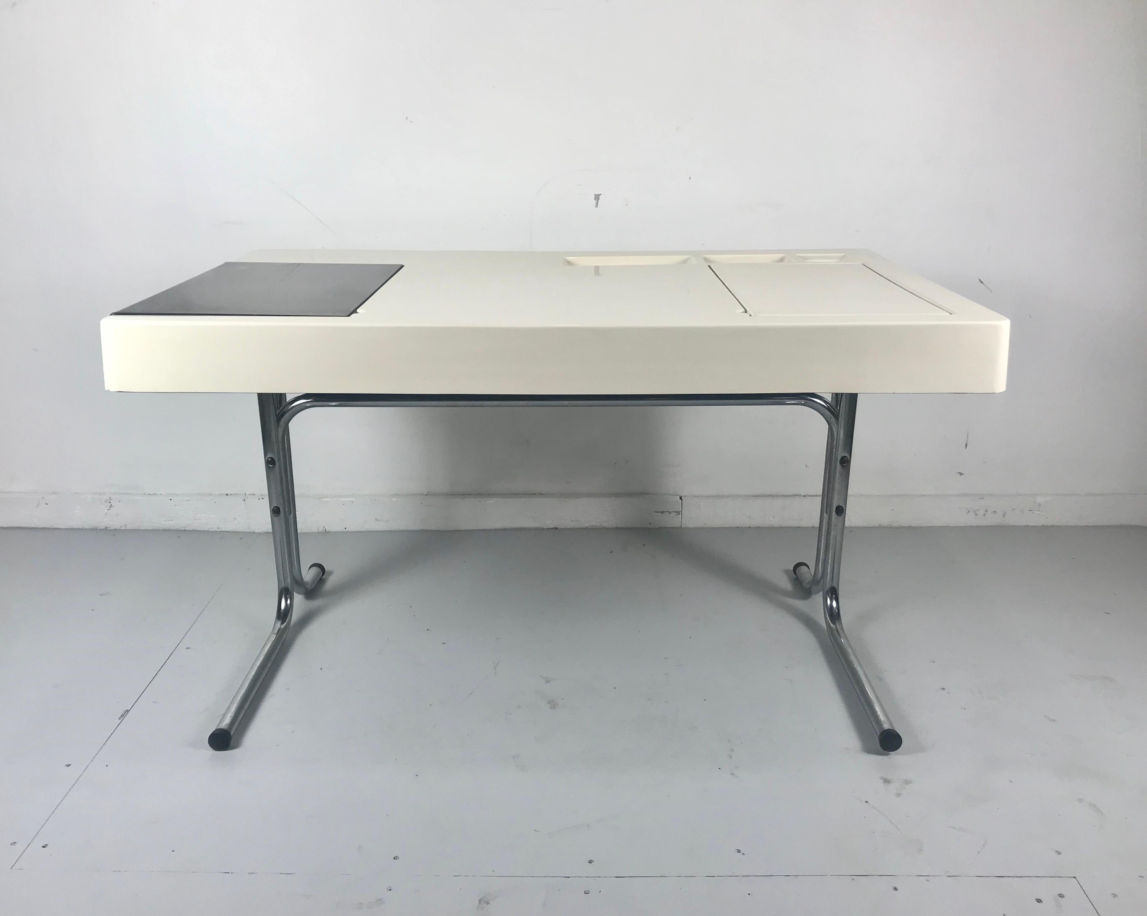 Space Age, futuristic plastic desk, Italian Design, 1970s,, Sleek .simple, modernist, moulded plastic and tubular chrome. Unusual right and left lids for storage, left lid smoke brown see thru acrylic. Hand delivery avail to New York City or