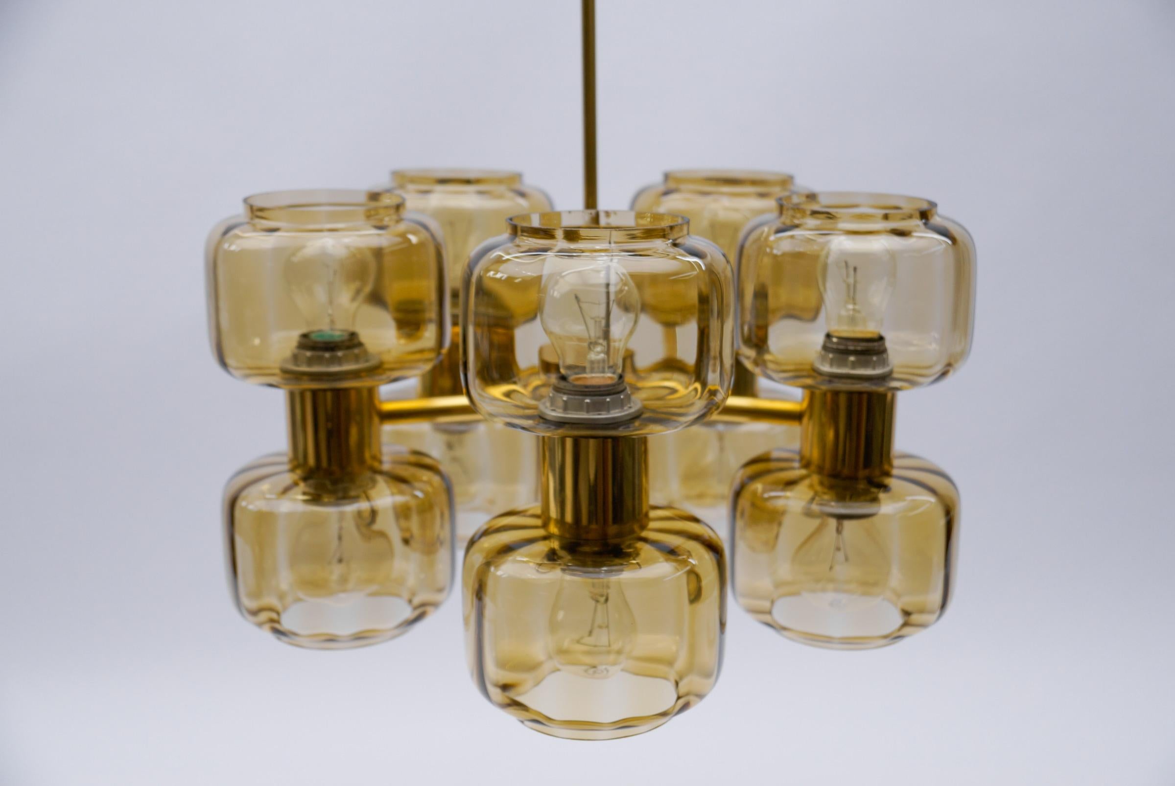 Executed in glass, metal and brass. The lamp needs 10 x E27 / E26 Edison screw fit bulb, is wired, in working condition and runs both on 110 / 230 volt.

Our lamps are checked, cleaned and are suitable for use in the USA.