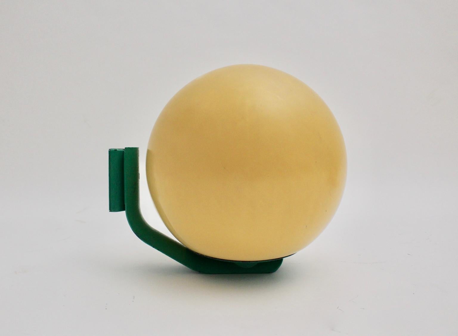 These eleven green vintage plastic globe wall lamps were designed and
executed by Guzzini (stamped), Italy, 1970s.
The wall lamps were made of green lacquered cast aluminum. Furthermore the globes were made of plastic.
Easy to fix on the wall