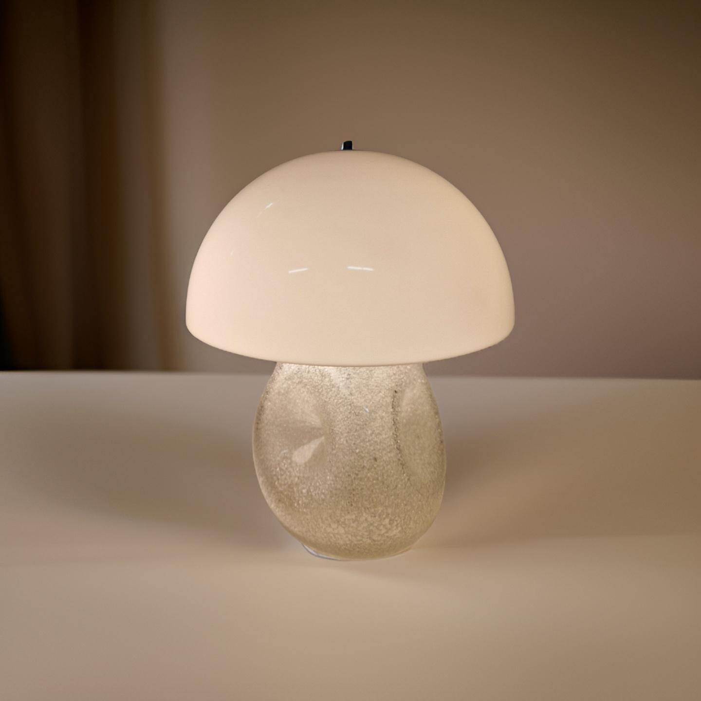 Mid century space age table lamp. The base is made from textured ice glass. It is textured on the inside of the base which shines through the glass giving it a textured outside appearance. It has three plugs that hold standard e27 bulbs. The