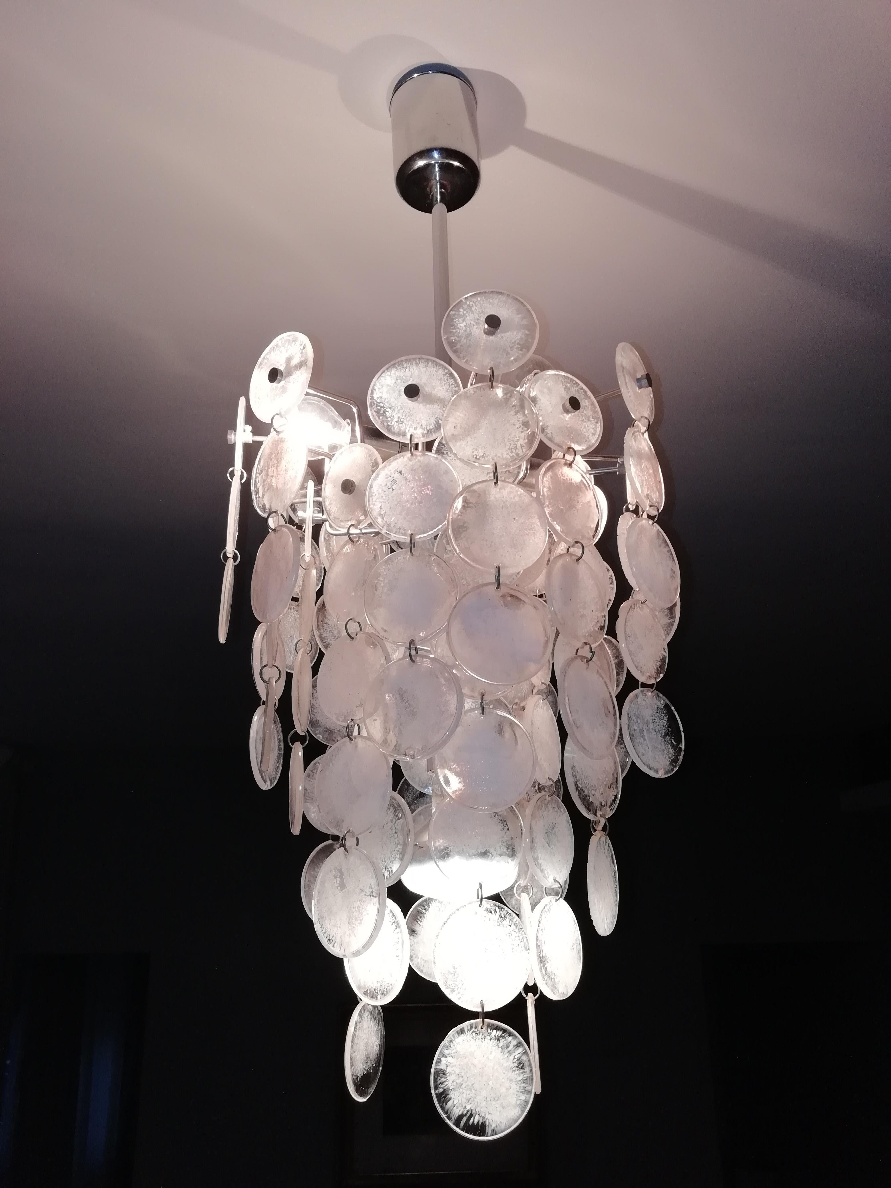 Mid-Century Modern 5-light chandelier composed of clear and opalescent Murano glass disks attributed to Mazzega and Carlo Nason, circa 1970.