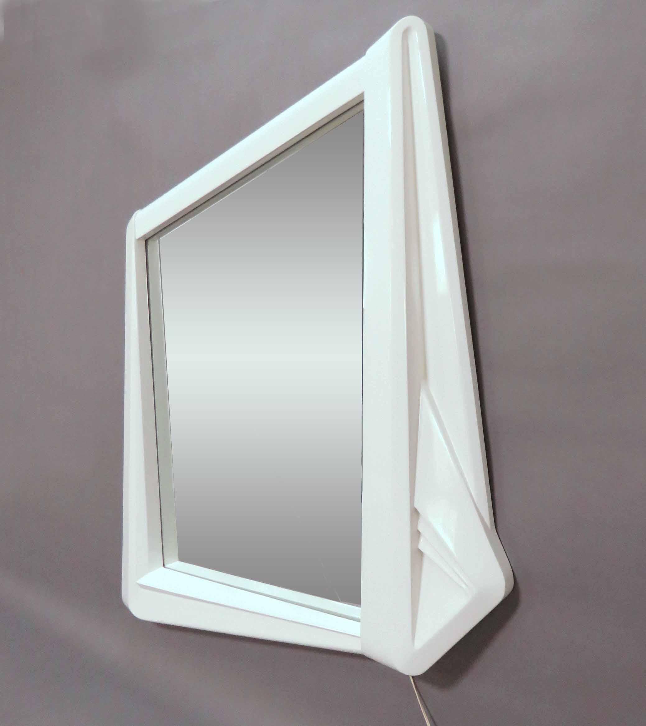 A rare pop art wall mirror with accent light, made in Italy, circa 1970s. Sculpted geometric (parallelogram) form.