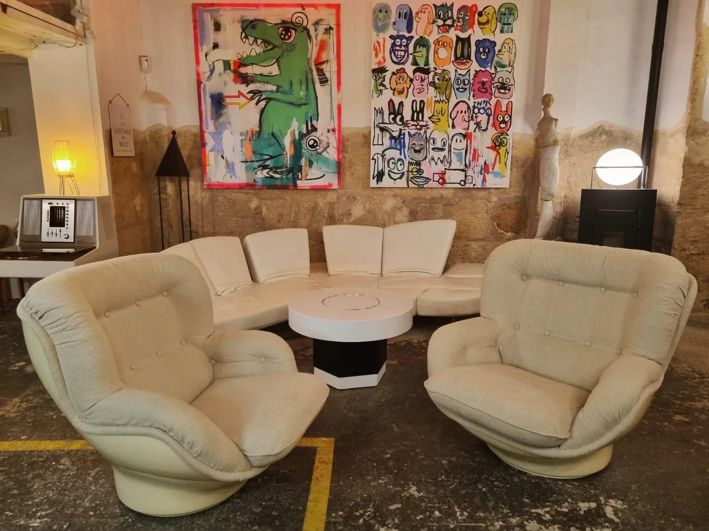 Rare pair (priced INDIVIDUALLY) of 'Karate' swiveling fiberglass shell chairs by Michel Cadestin. 

These iconic chairs were designed circa 1970 by Michel Cadestin for French furniture manufacturer Airborne. 

Referred to as the 