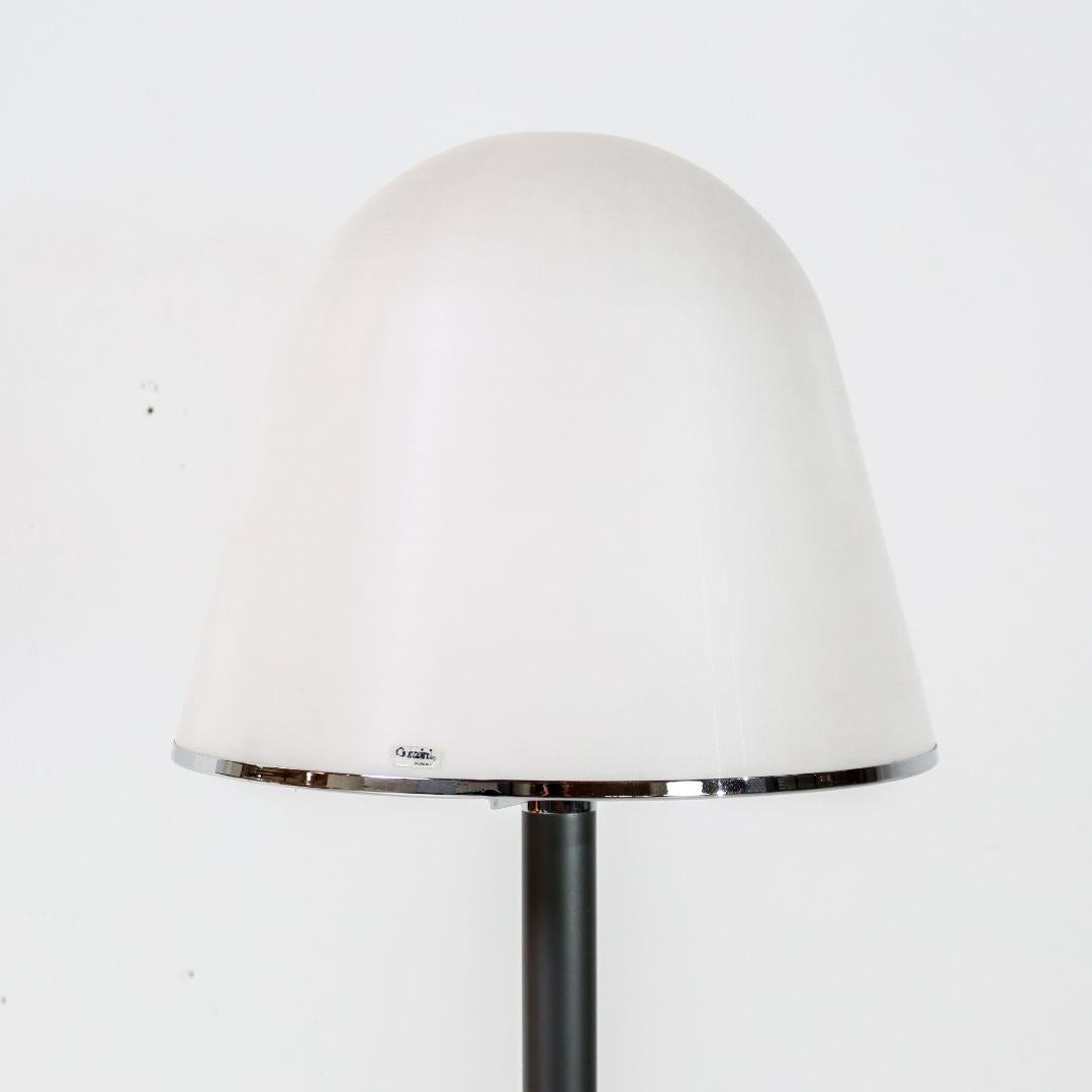 Italian floor lamp by Franco Bresciani for iGuzzini (Harvey Guzzini) from the 1970s. The lamp features a metal rod with a plastic shade. The shade has a relatively large diameter of 30 cm and emits a beautiful warm light. The 'Kuala' lamp is in good