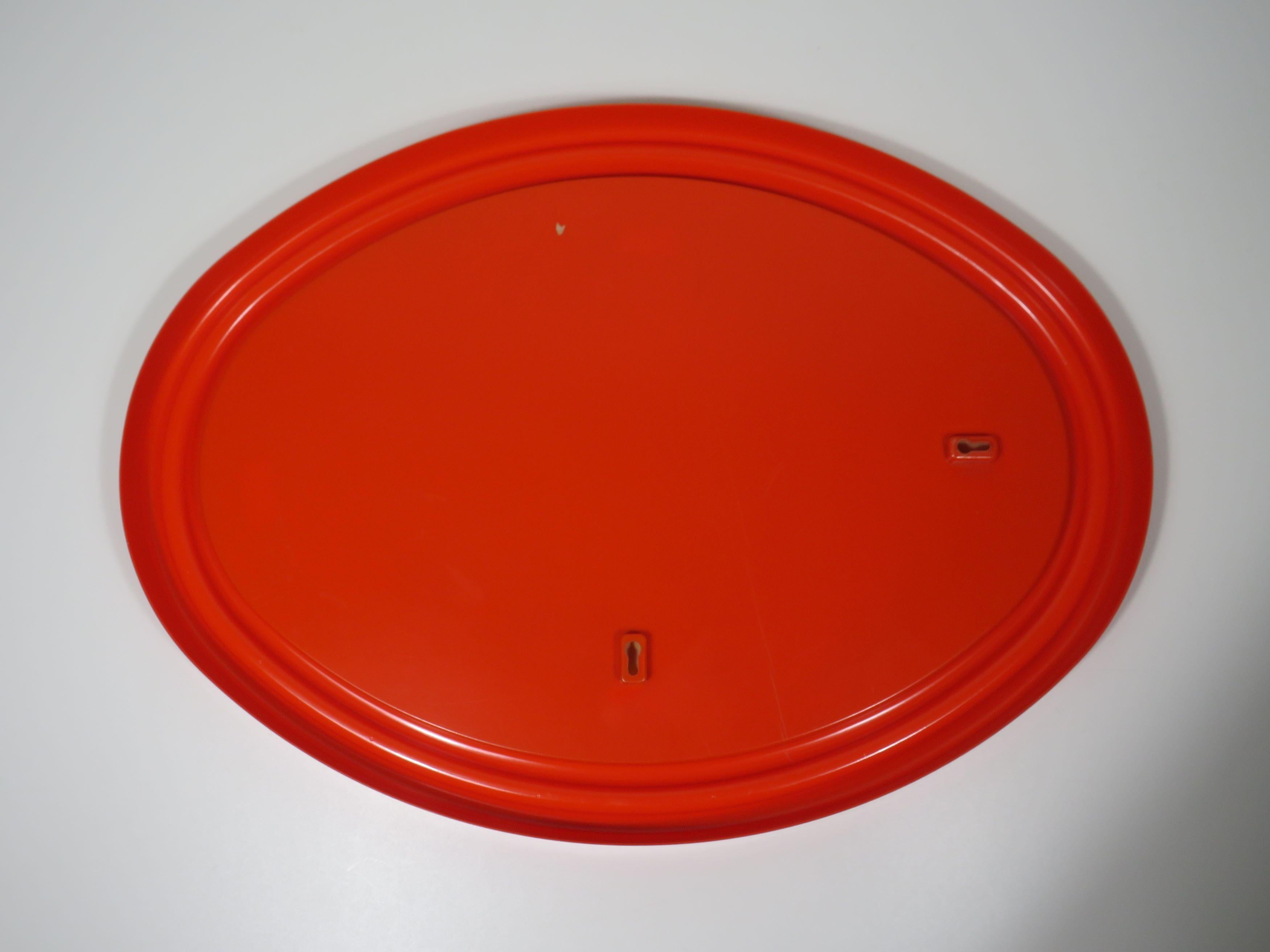 Molded Space Age large orange oval mirror 1960s in the style of Guzzini, V.Panton For Sale