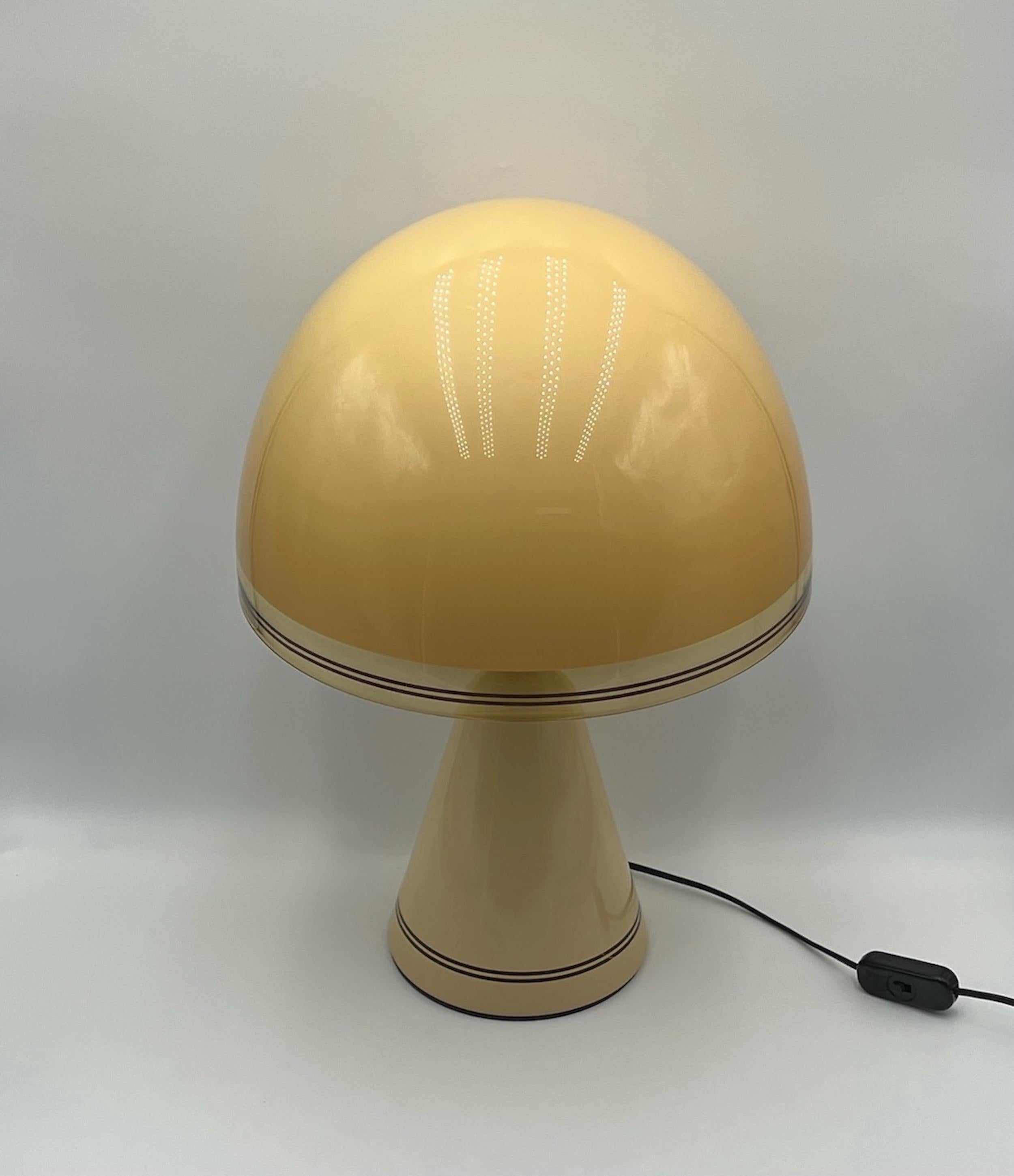 Space age iconic Table Lamp 'Baobab' by iGuzzini - a project conceived by iGuzzini design team in 1976 and produced by the world-famous italian maker from 1978 until 1992.  

Baobab is made with a truncated ochre conical base in turned metal (iron),