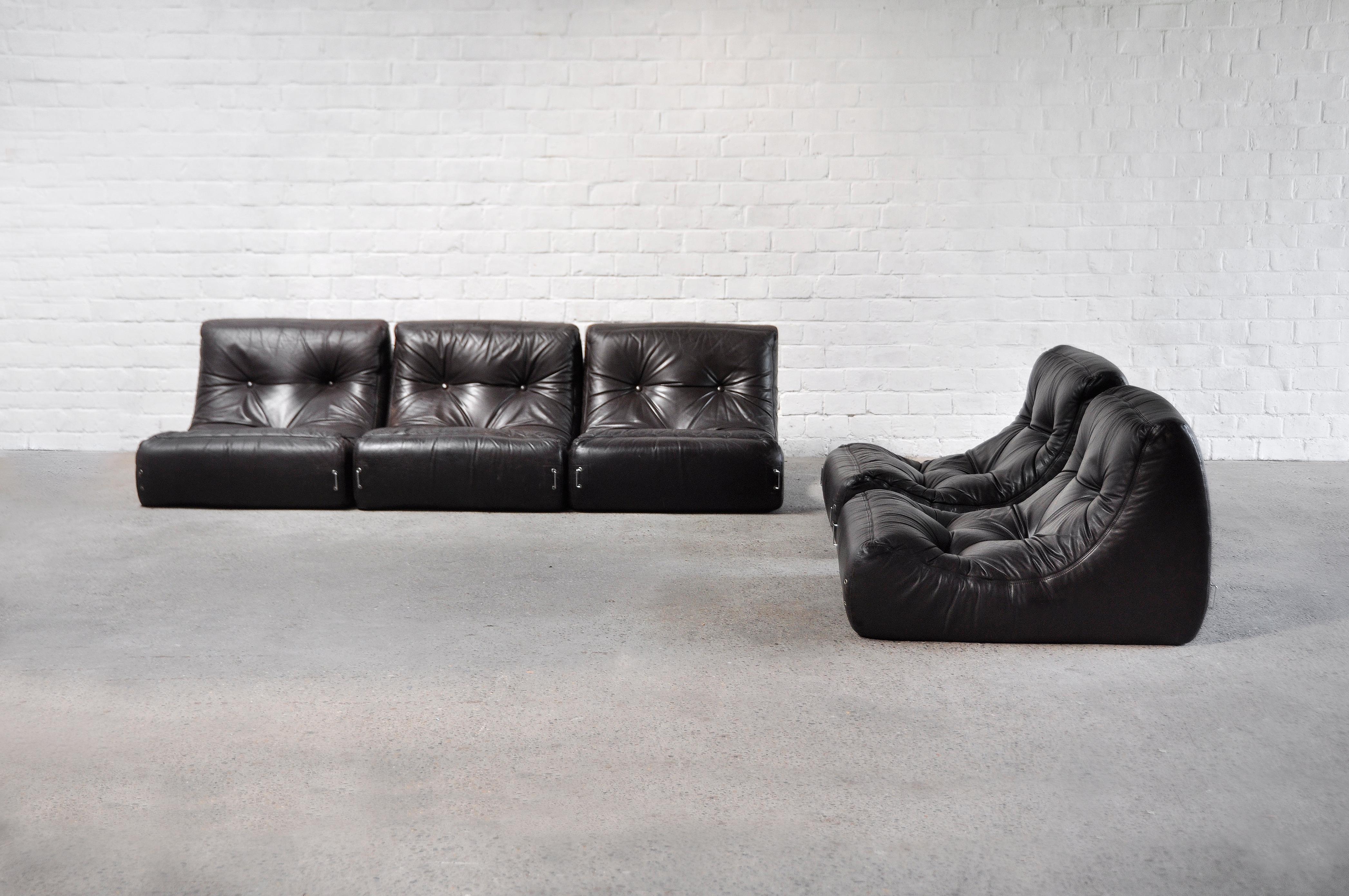 A unique 1970’s French modular sofa set consisting out of 5 individual pieces. Attributed to Michel Ducaroy, this set is made out of dark brown leather and sits low to the ground for a typical Space-Age or Modernist look. The seats are extremely