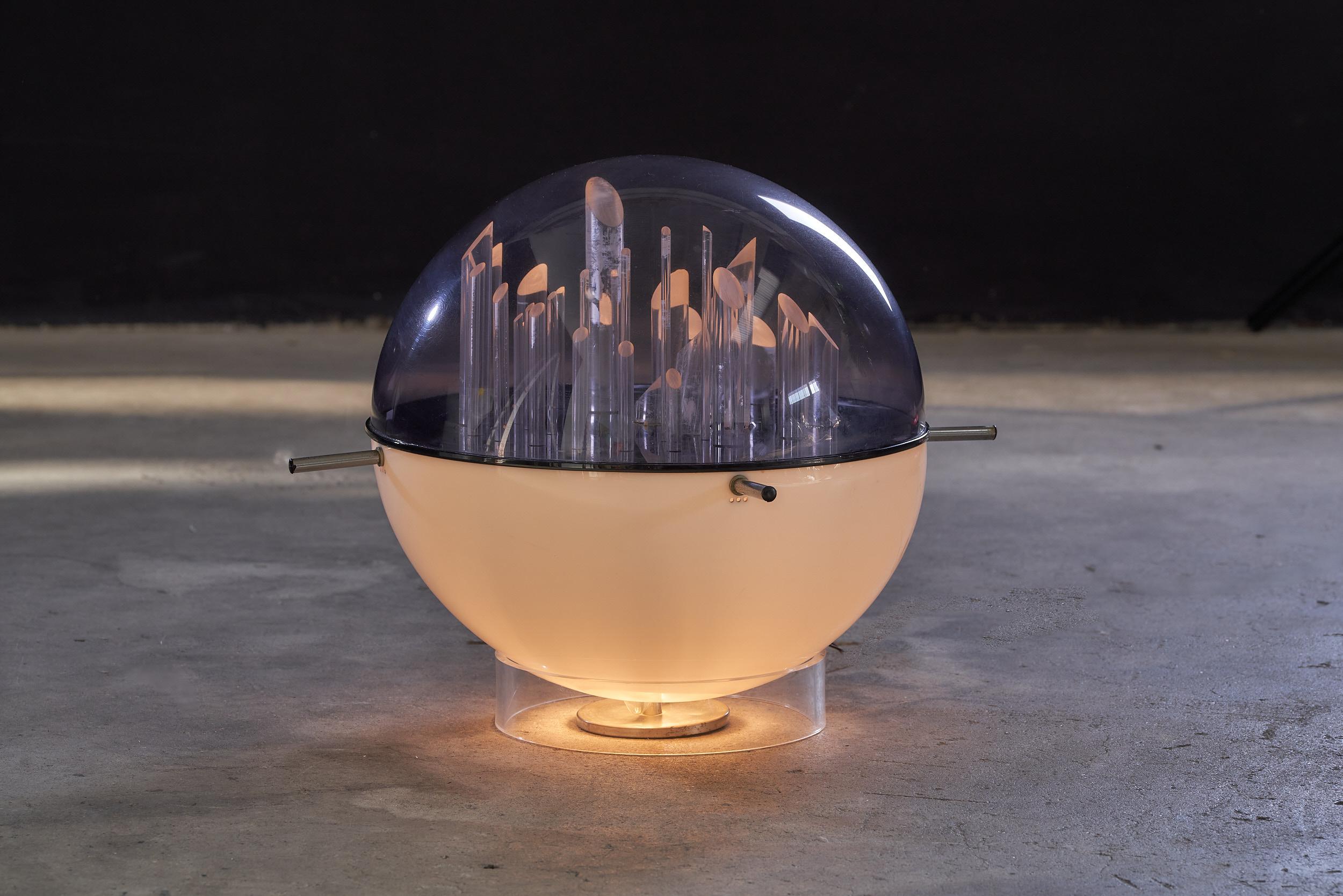The Italian Space Age acrylic glass sculptural lamp by Gaetano Missaglia, from the 1970s, is a stunning piece of lighting design that captures the essence of the Space Age era. Created by the celebrated Italian designer, Gaetano Missaglia, this lamp
