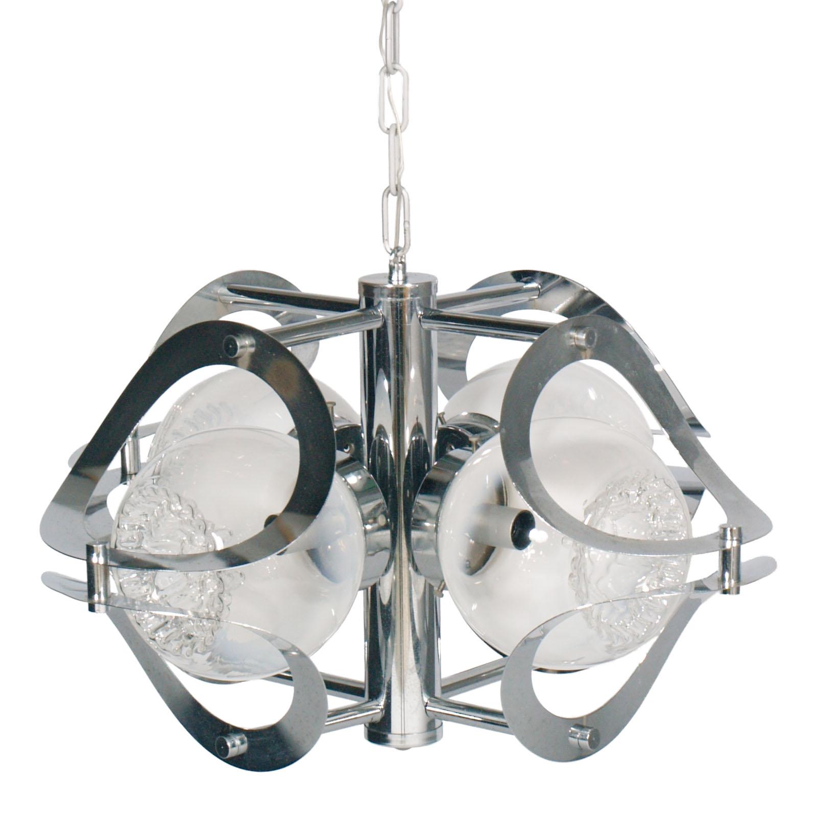 1970s chandelier by Mazzega Murano in chromed steel and Murano glass, 4-light, with overhauled electrical system

Measures cm: Height 90/32, diameter 48 

Mazzega Murano is famous for their gorgeous glass lamps, each handcrafted, as well as