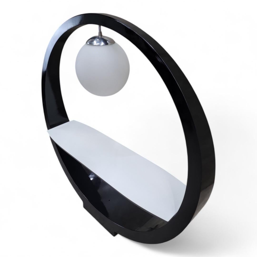 Vintage Space Age Modern Sculptural Attributed to Modeline of California Floor Lamp Shelf

Rare lamp table Attributed to Modeline of California. A tapered black circle, thicker at the bottom, supports a white floating shelf and a glass globe light