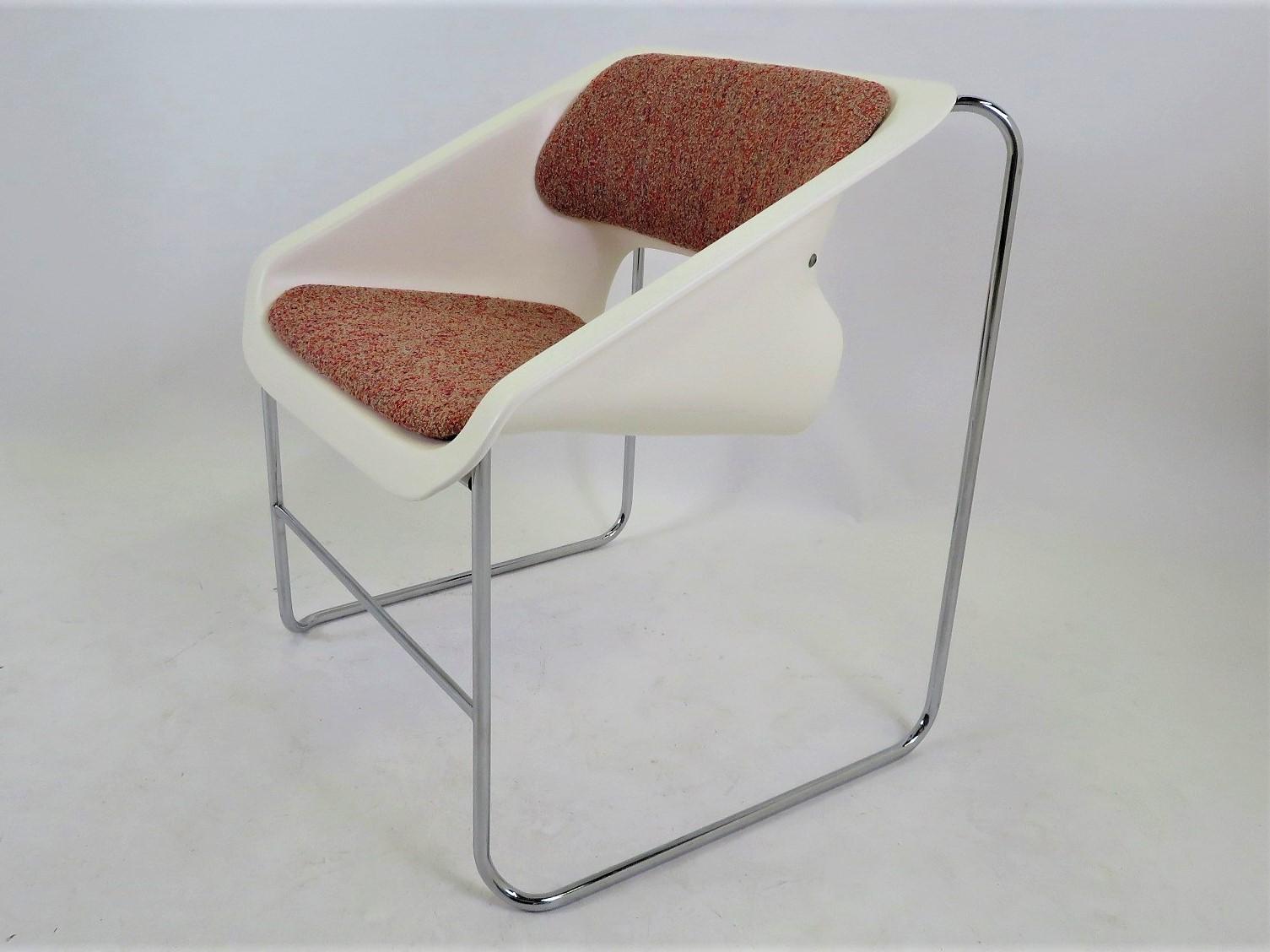 Space Age Modern armchair created by Paul Boulva for the Montreal Olympics in 1976 and produced by Artopex of Canada. The chair sport a chromed metal frame with molded plastic seat with back and seat upholstered. The chair is covered in a Boucle