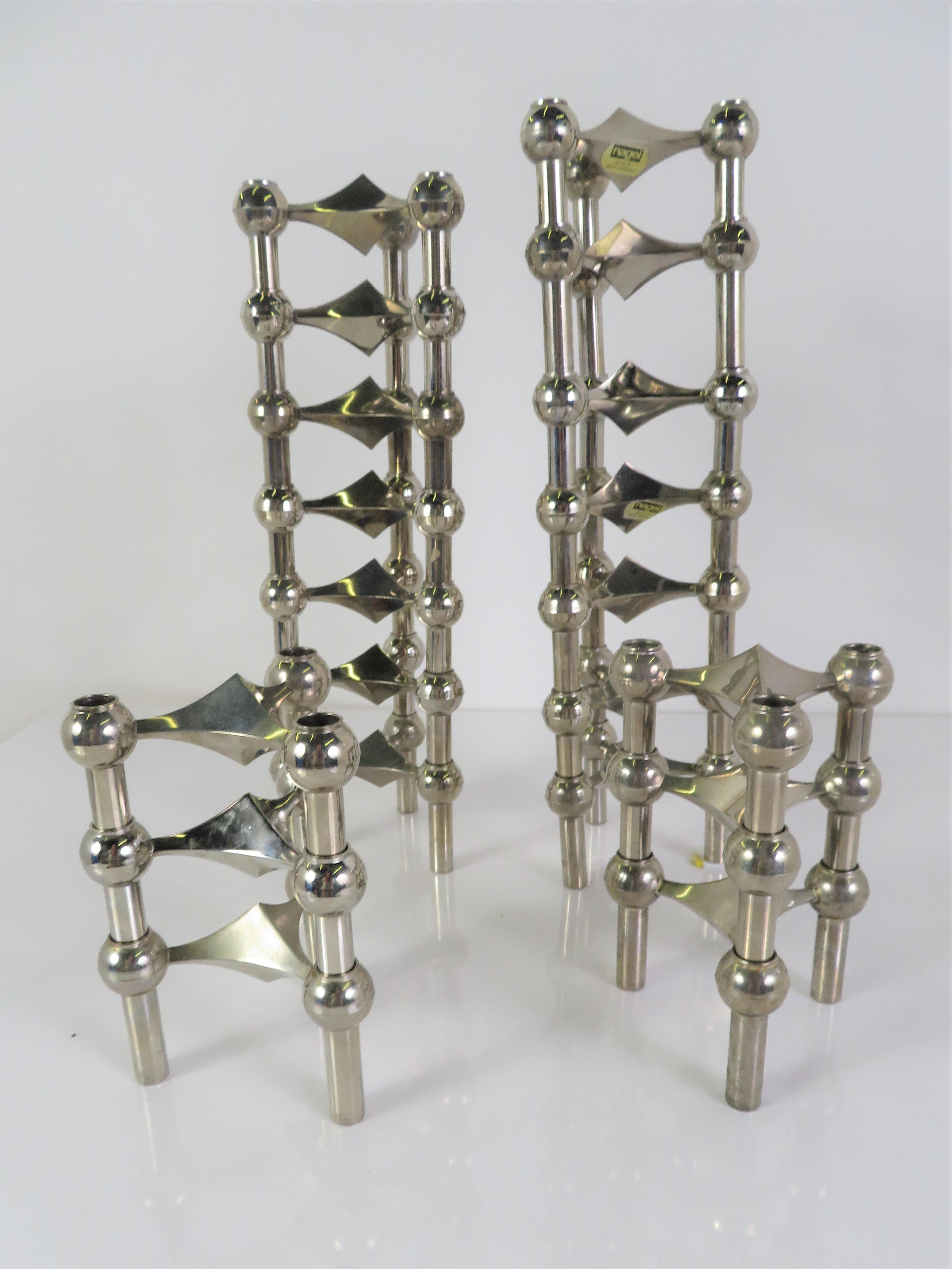 A set of 20 S-22 model stackable 3-legged chrome modular candleholders by Hans Nagel (1926-1978) and Werner Stoff (1940-2021) from the 1960s. Made in Germany, the special beauty of the design is that any number of candleholders can be combined into