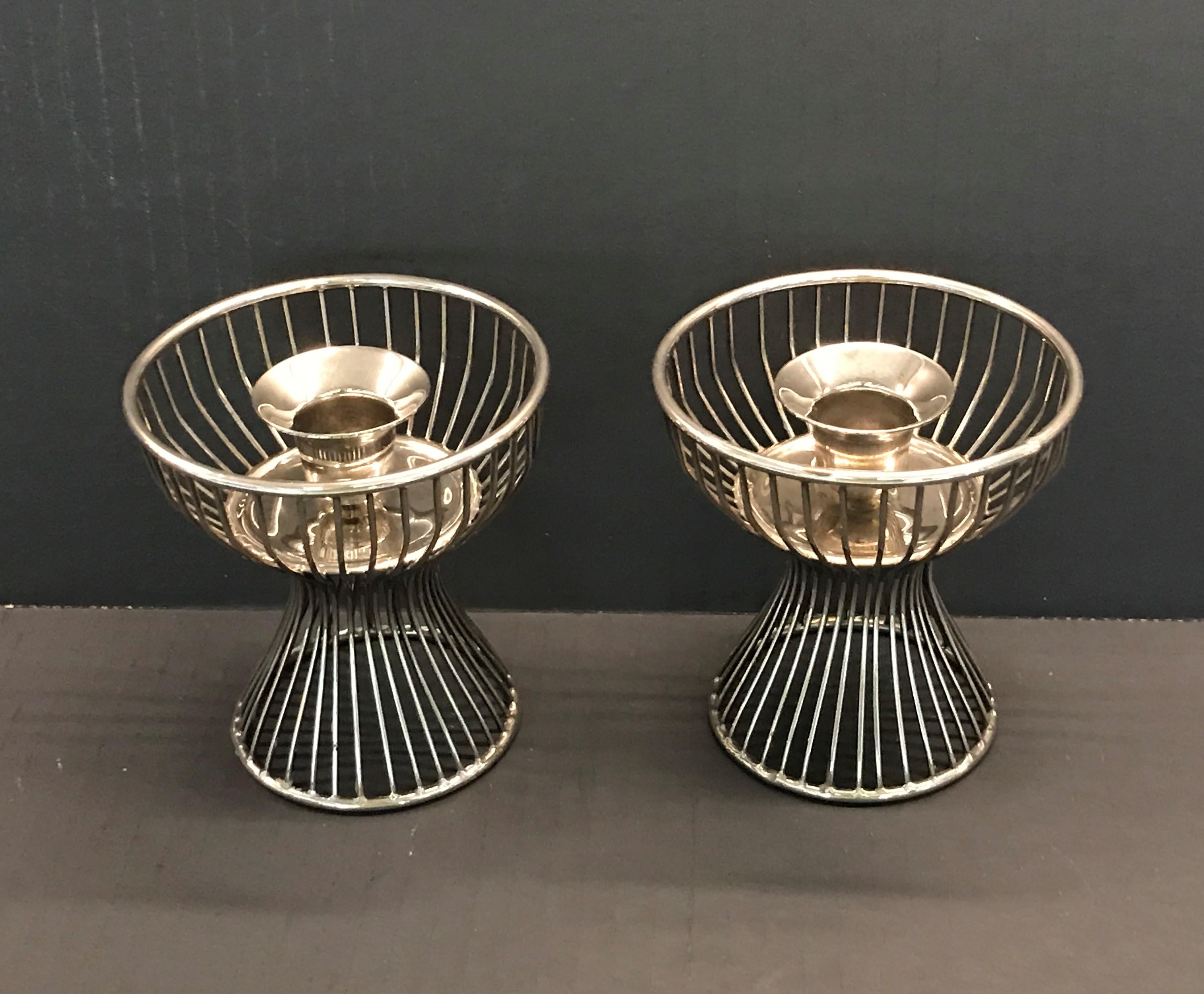 Pair of silver plated metal candleholders echoing the iconic shape of Warren Platner's tables and chairs for Knoll International. These were made in Hong Kong of an unknown designer. Elegant in a light and airy form.
Measurements: 4 inches diameter