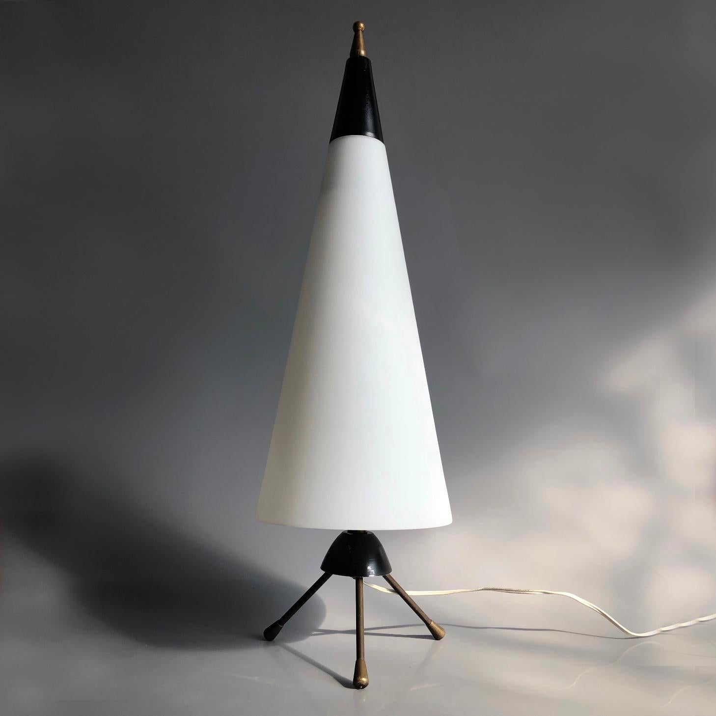 Space Age modernist table lamp, Italy, 1960s. Conical satinated milk glass shade, metal structure wirh brass tripod base. Black painted metal parts. Very good original condition. Two original Italian brass E14 sockets with original and functioning