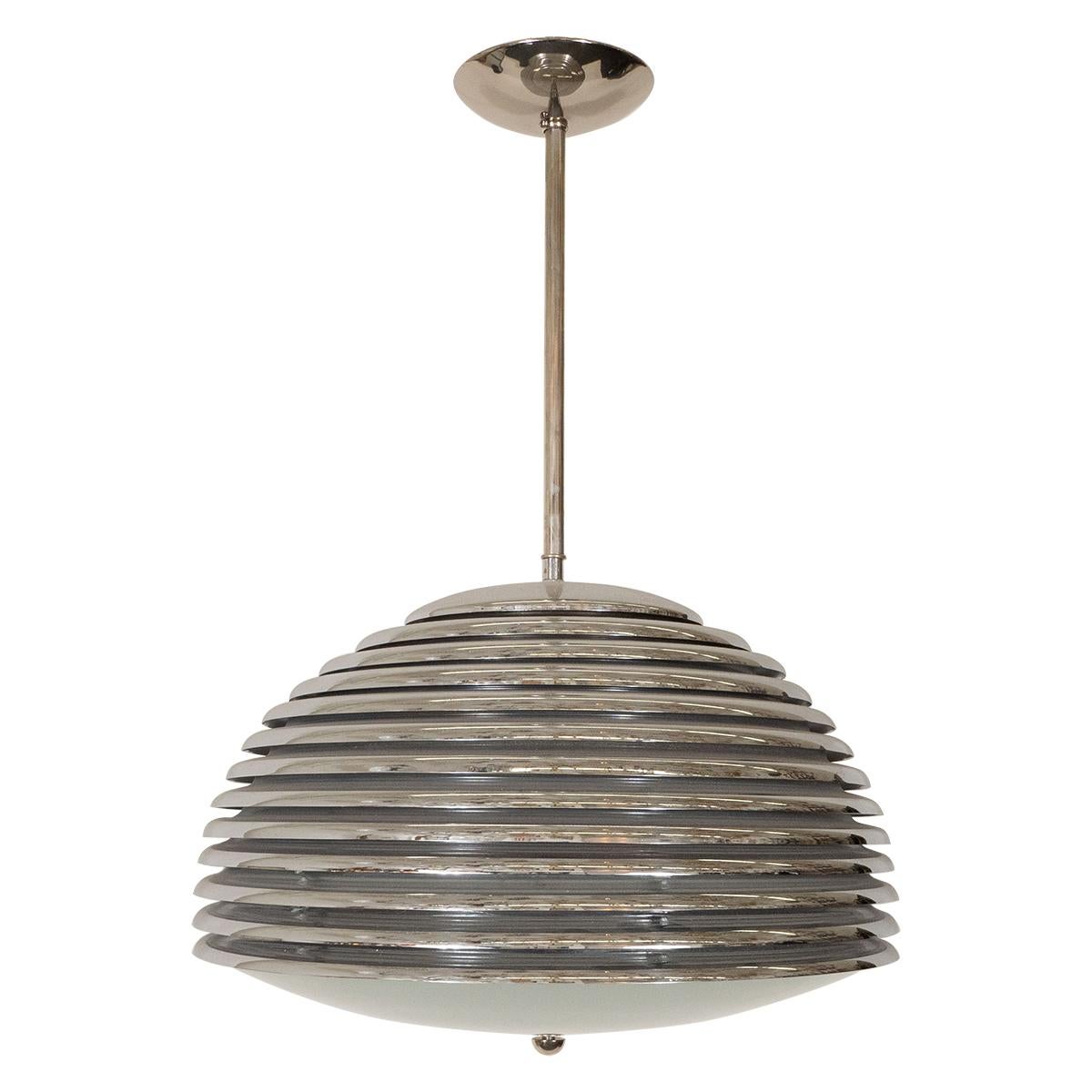 Space-age polished nickel pendant with frosted glass shade.