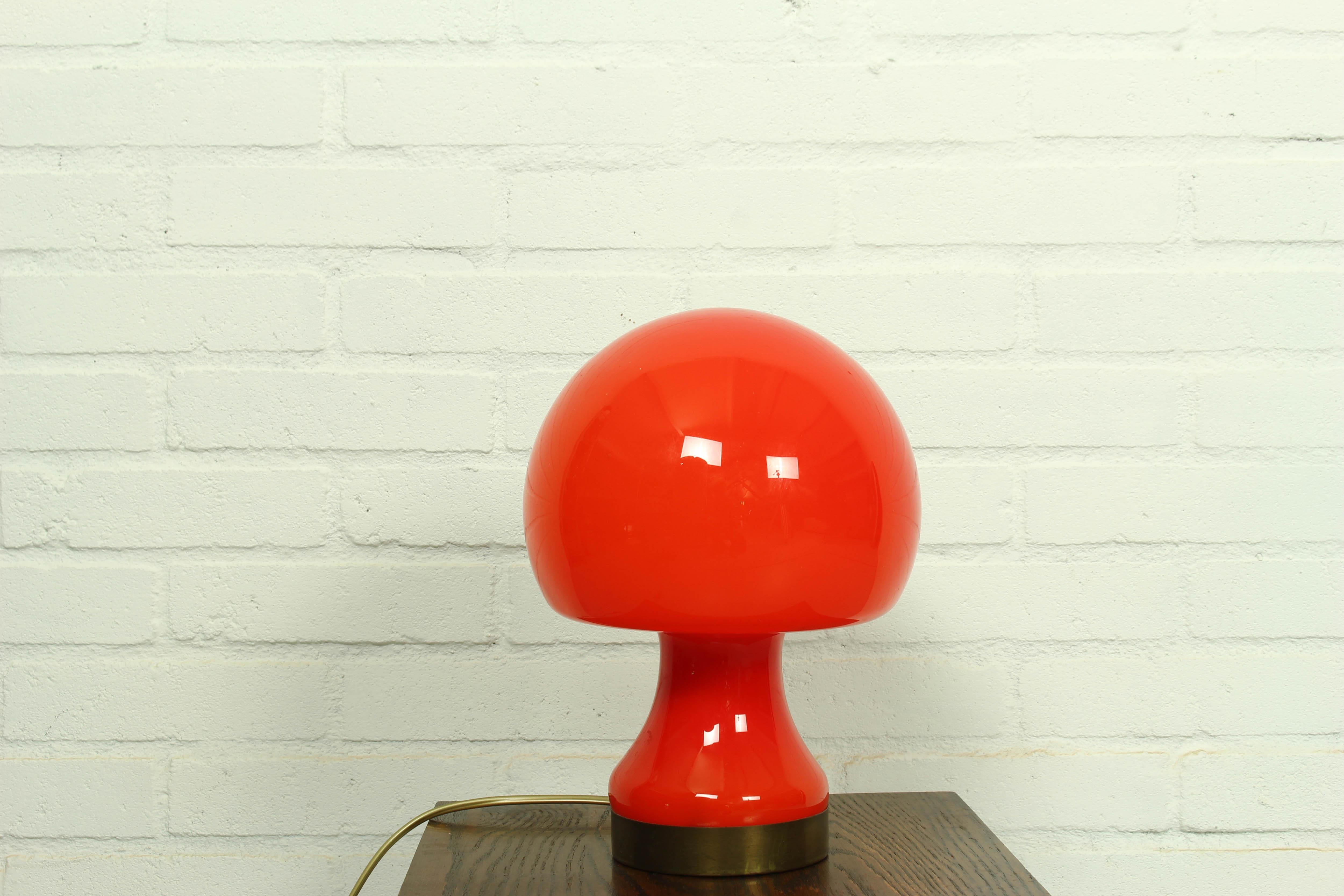 Vintage red mushroom table lamp was made in Italy in the 1970s. Retro lamp will bring to your home the atmosphere of 70s Italy, the era of the space age. A mid-century table lamp will look great in an Art Deco or Mid-Century Modern interior.