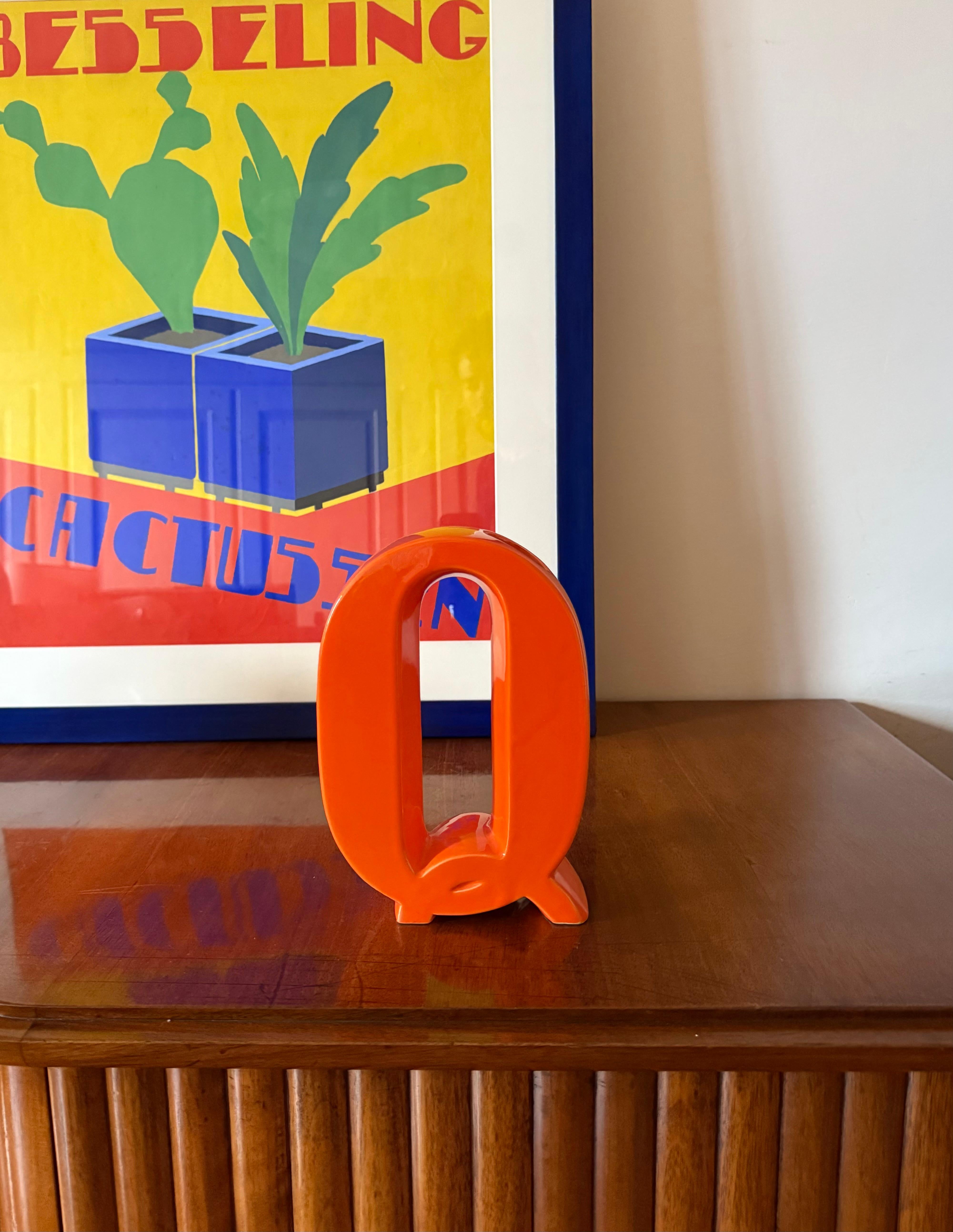 Space age orange Q letter shaped ceramic solifleur vase

Creations Marcel Radureau France ca. 1970

H 20.5 cm - 15 × 6 cm 

Conditions: very good consistent with age and use. Chip on the vase