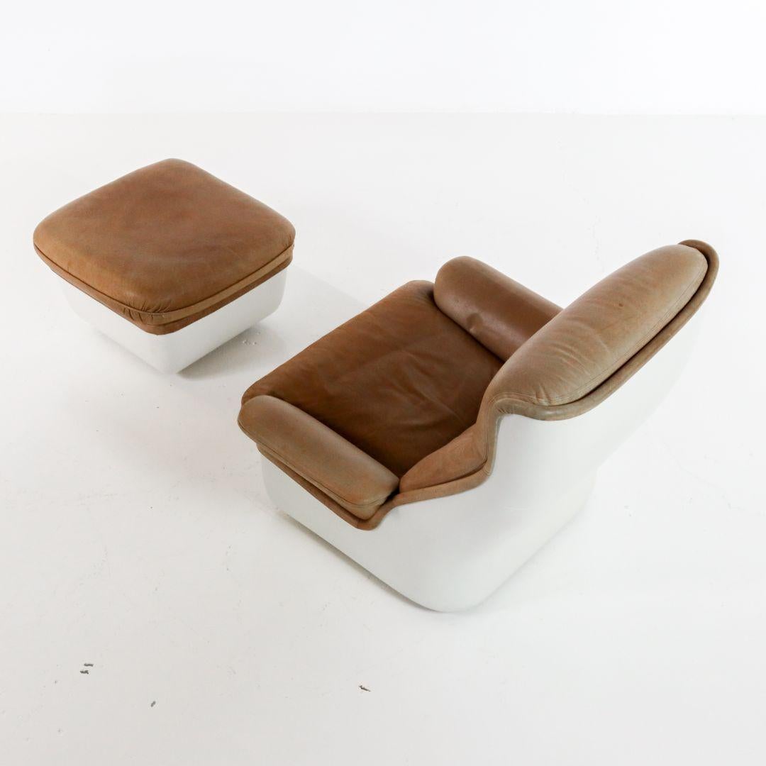 This Space Age fiberglass armchair with footstool, the 