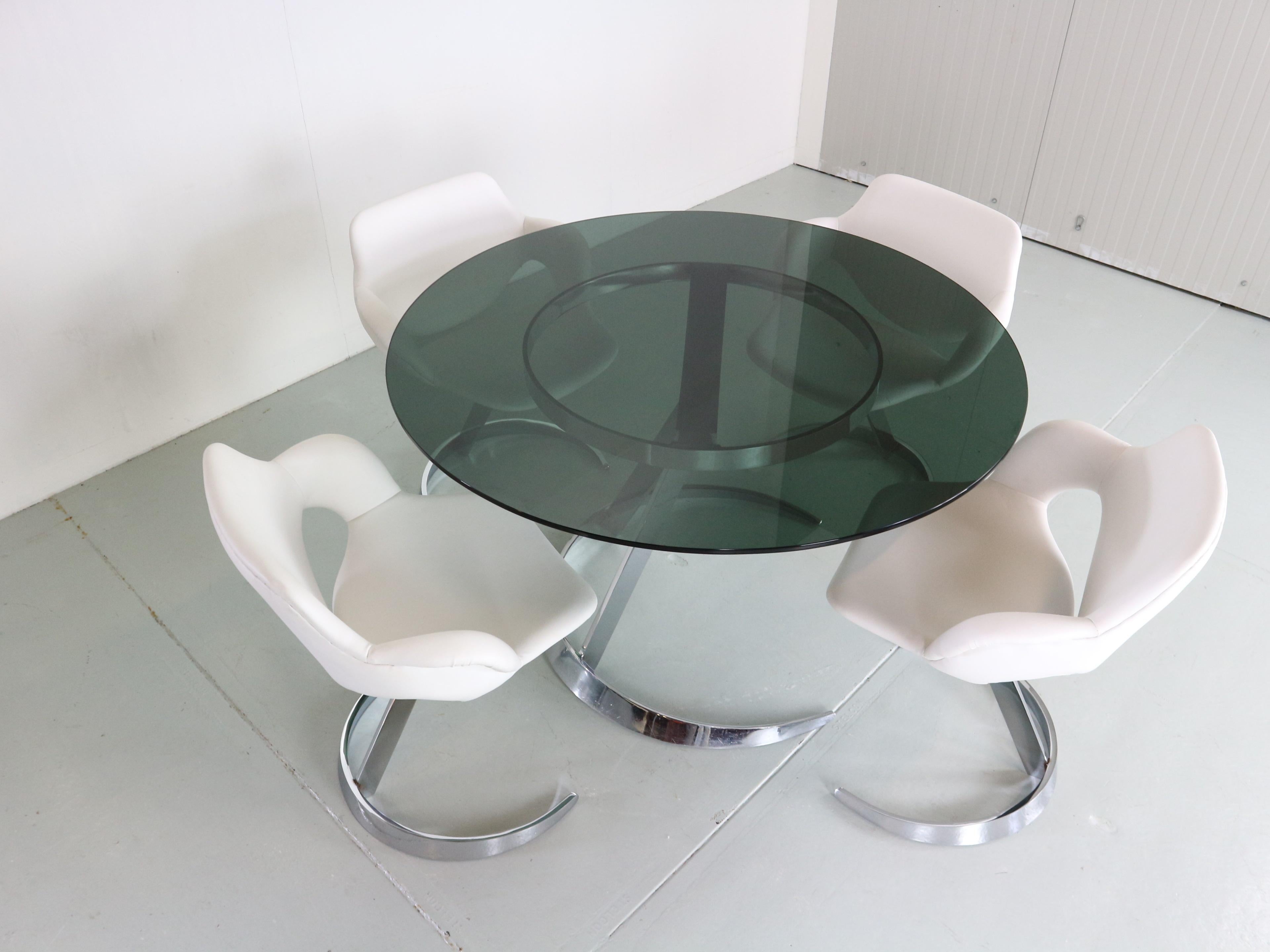 Space Age period dining room set designed by Boris Tabacoff and manufactured for Mobilier Modulair Moderne in 1970s circa period, France.

The set consists of the round dinning table and 4 matching chairs.
Round table is standing on a solid chrome