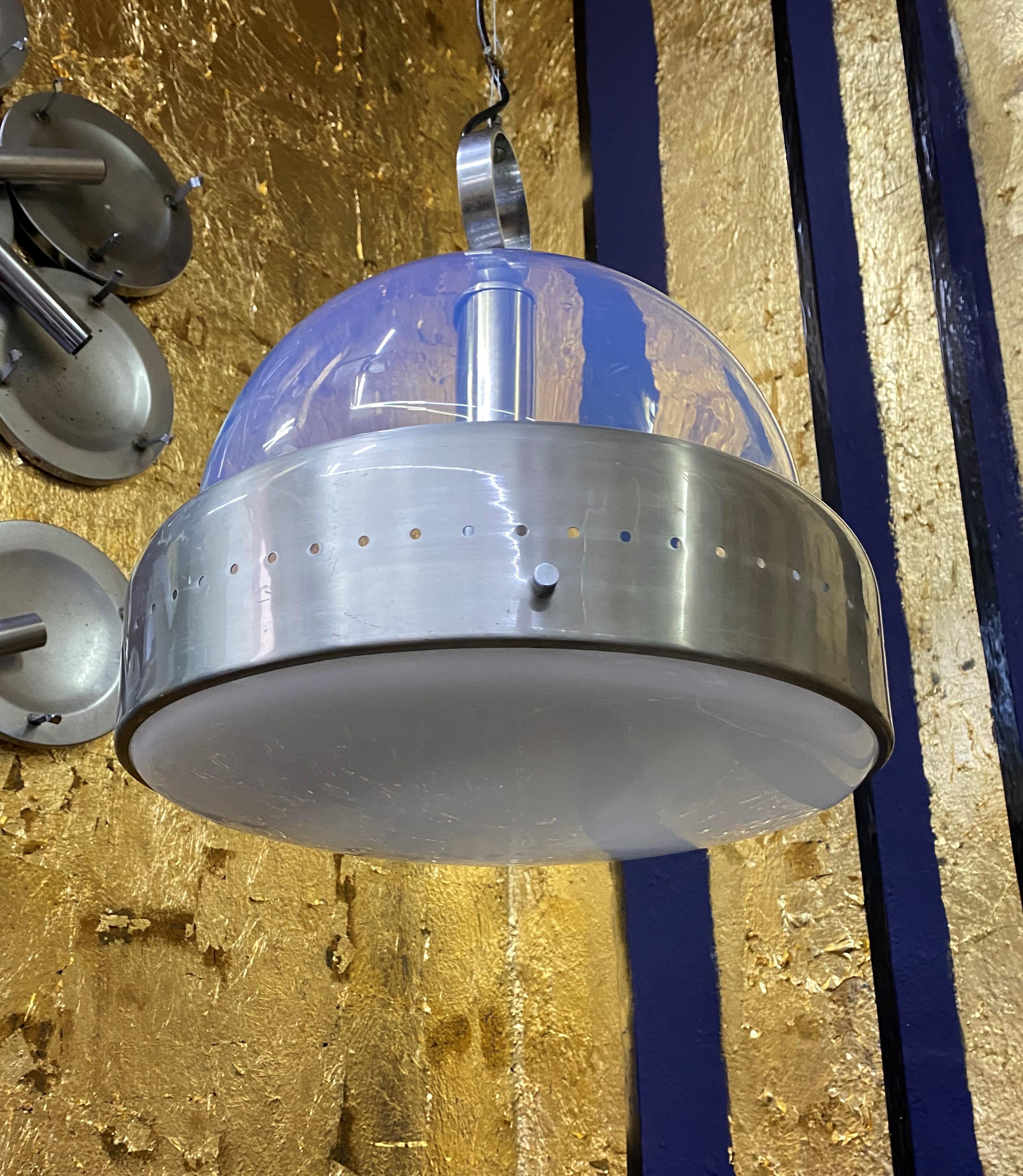 Mid-Century Modern hanging light consisting of 3 pieces, one blue opalescent glass bell, an aluminium ring and the lower tier in white opaline glass.
No specific maker has been identified but comparable to models by Mazzega, Vistosi and