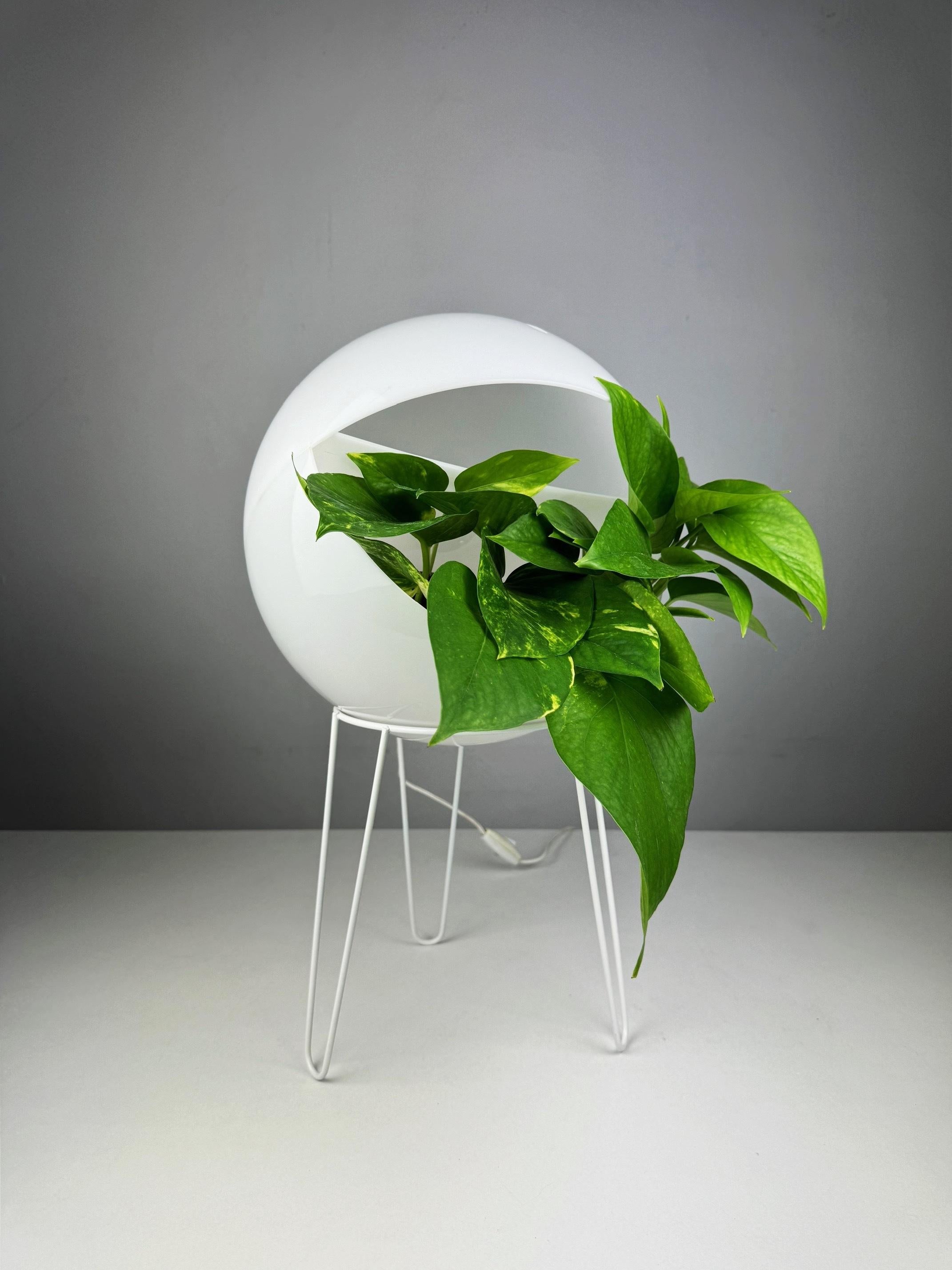 Late 20th Century Space Age plant lamp from the 1970s designed with a built-in plant holder