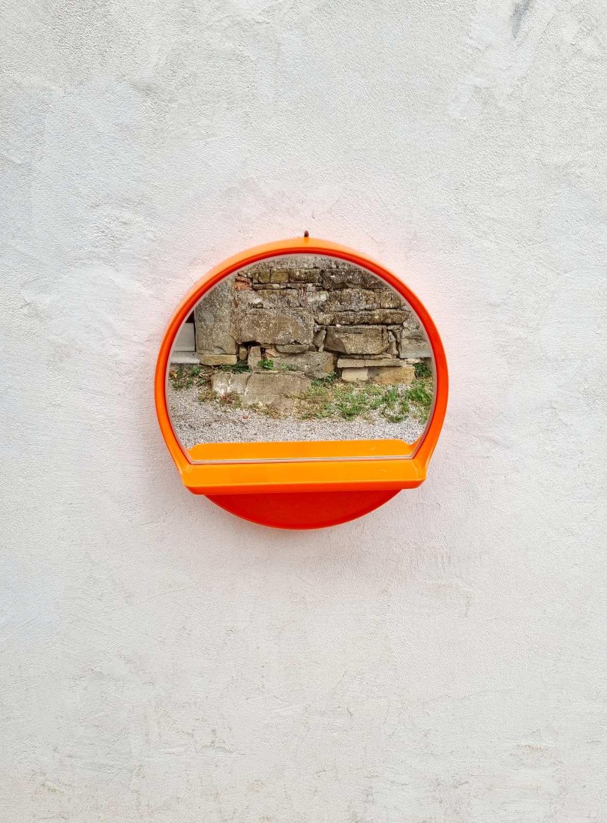 large round mirror with shelf