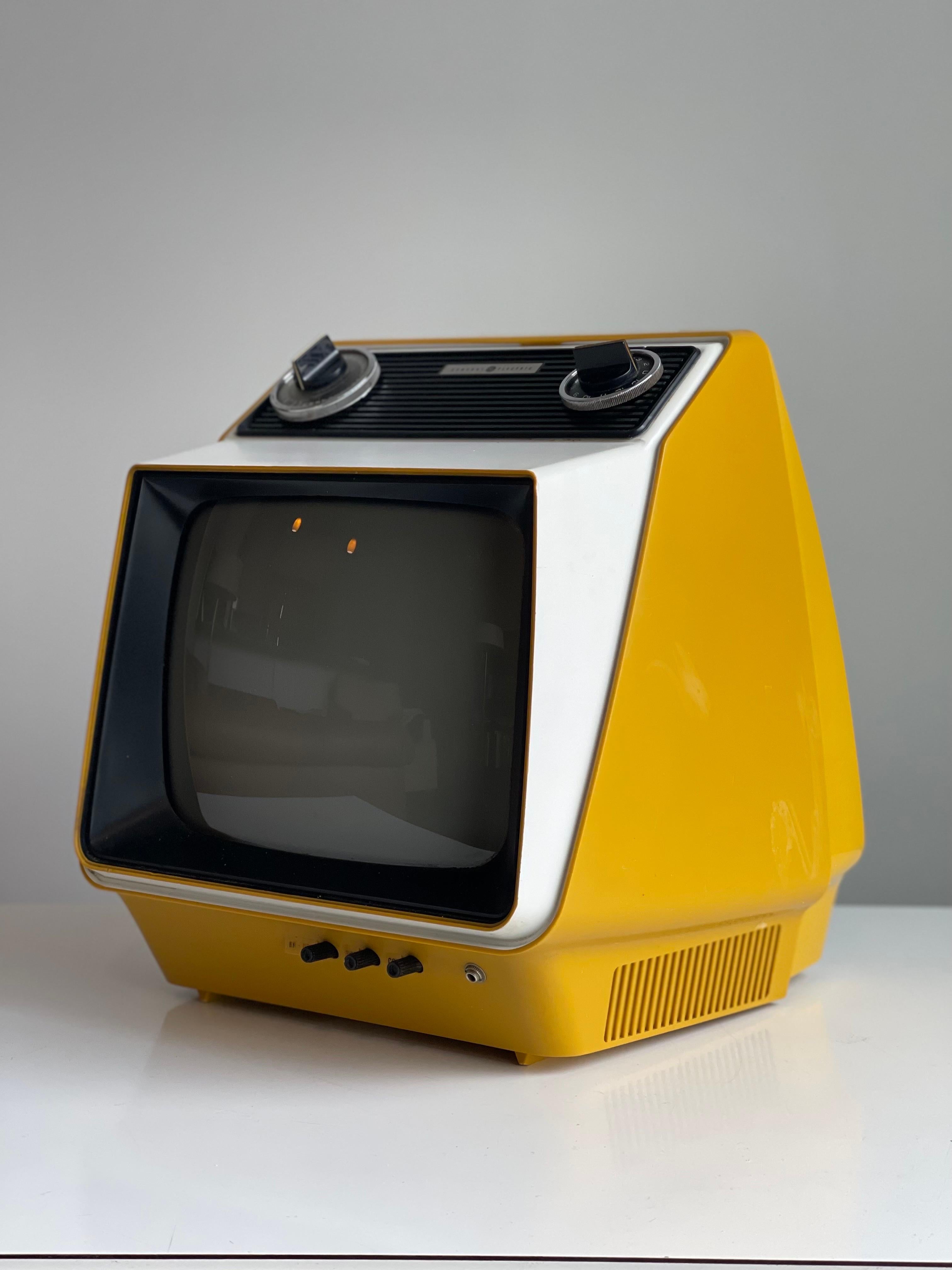 Eye Catching rare Space Age portable television set in nice vintage working condition. This would be excellent in any home that wants a cool piece of decor that will be a conversation starter. These are hard to find - very minor wear. It would need