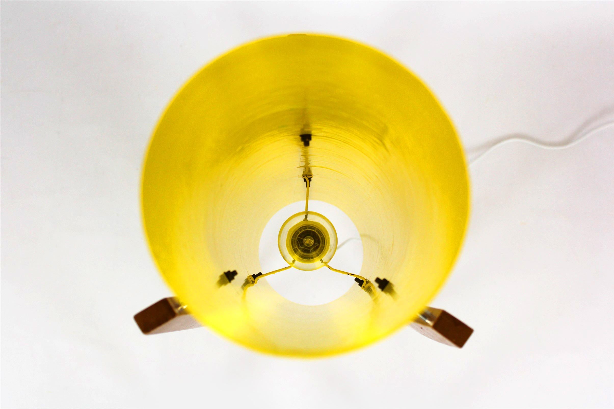 This floor rocket lamp was produced in the 1960s in Czechoslovakia.
It features yellow fiberglass shade on three wooden legs.
The lamp is fully functional and has a new wire.