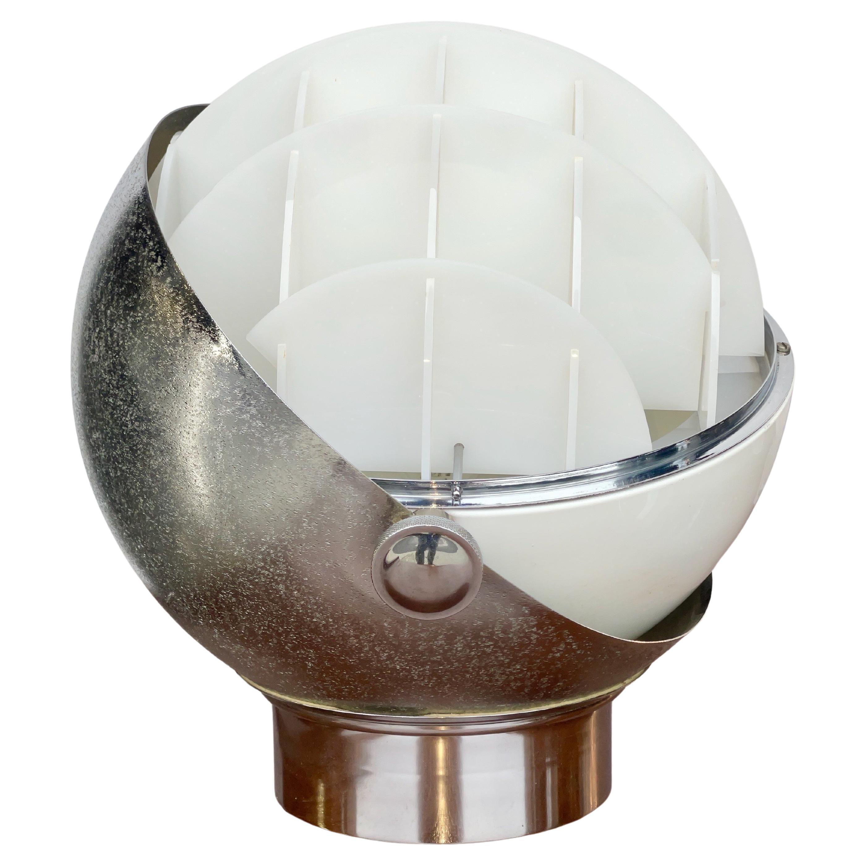 I’ve been trying to identify who designed and produced this 'cool af' lamp since I bought it in Italy over a decade ago. 
The white plexi reflectors call to mind Joe Colombo’s semi-spherical Continental bookshelves. 
It would certainly be
