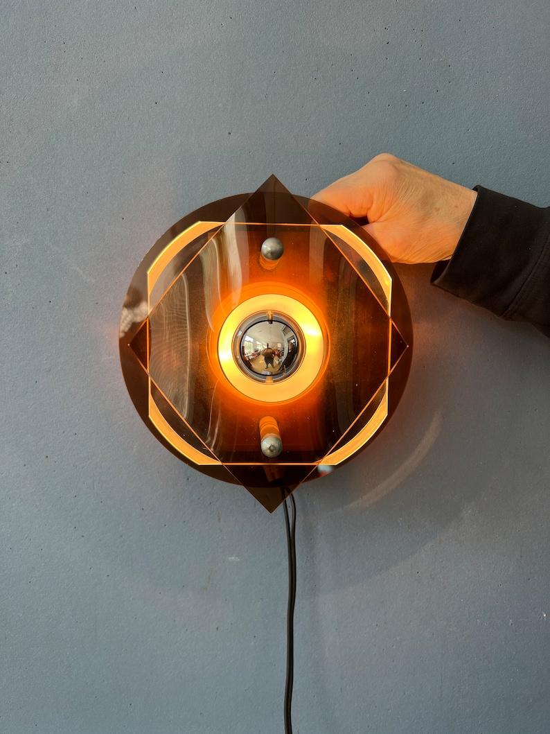 Metal Space Age Rounded Plexiglass Wall Sconce / Perspex Wall Lamp by Herda, 1970s For Sale