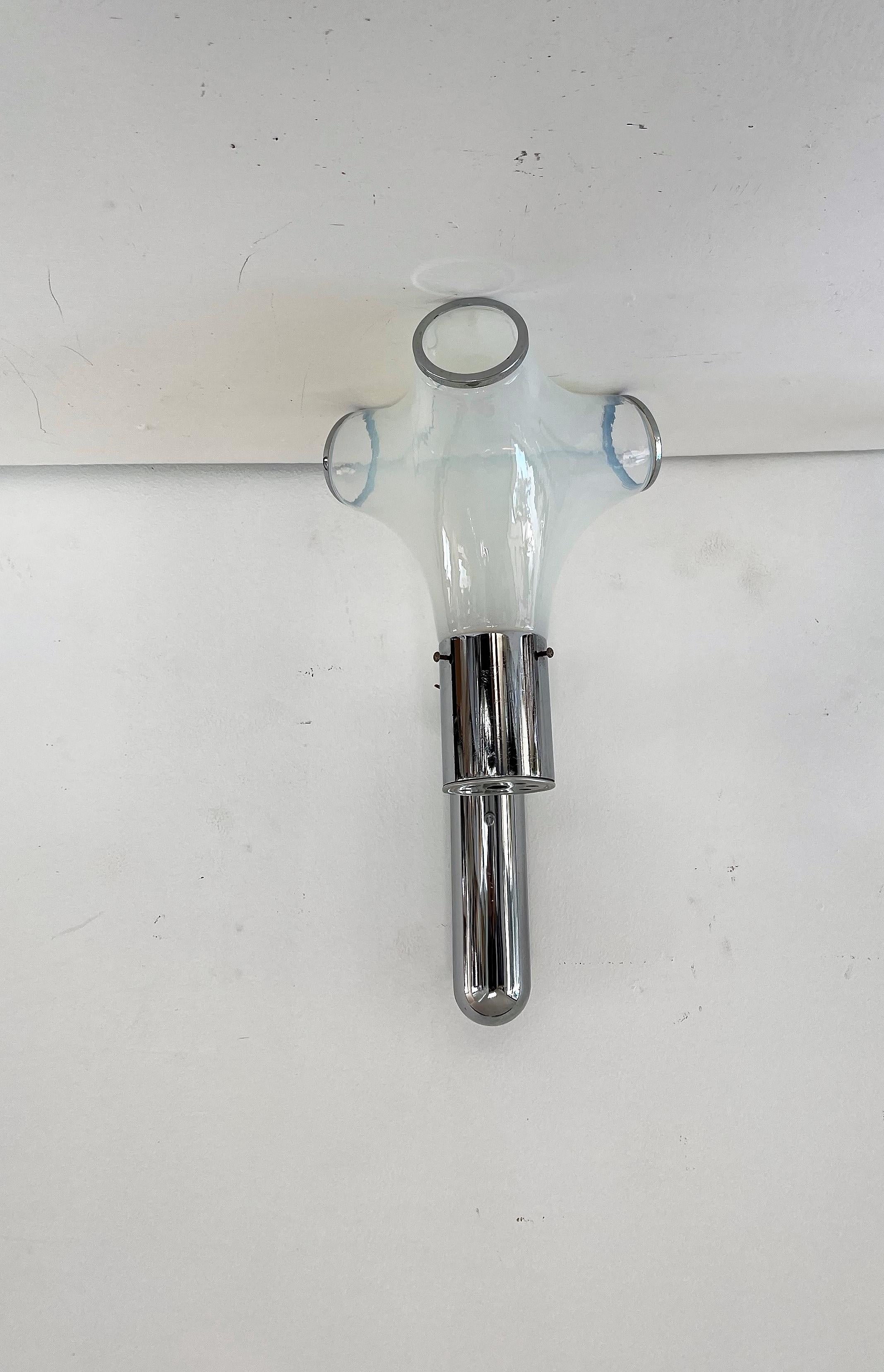 Gorgeous Space Age sconces designed by Aldo Nason for Mazzega circa 1970 in Murano Italy.
Manufactured in opalescent blue Murano glass and chromed hardware this sconce is a great example of Space- Age design.
The sconce takes 1 e14 bulb.
4