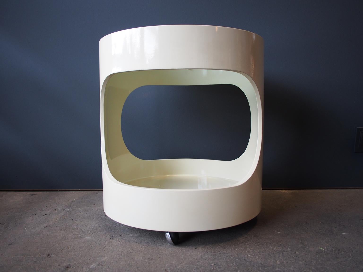 The cream-colored small side table on wheels is ideal as a bedside or coffee table. Opal is known for its Space Age tables with organic futuristic shapes. The table has a smoked glass top.