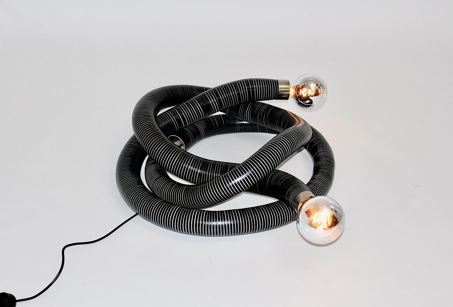 Space Age snake vintage tube floor lamp from plastic and metal in black and grey with flexibles tubes designed and manufactured Italy 1960s.
The design from this outstanding floor lamp is similar to Boalum by Gianfranco Frattini.
Flexible metal
