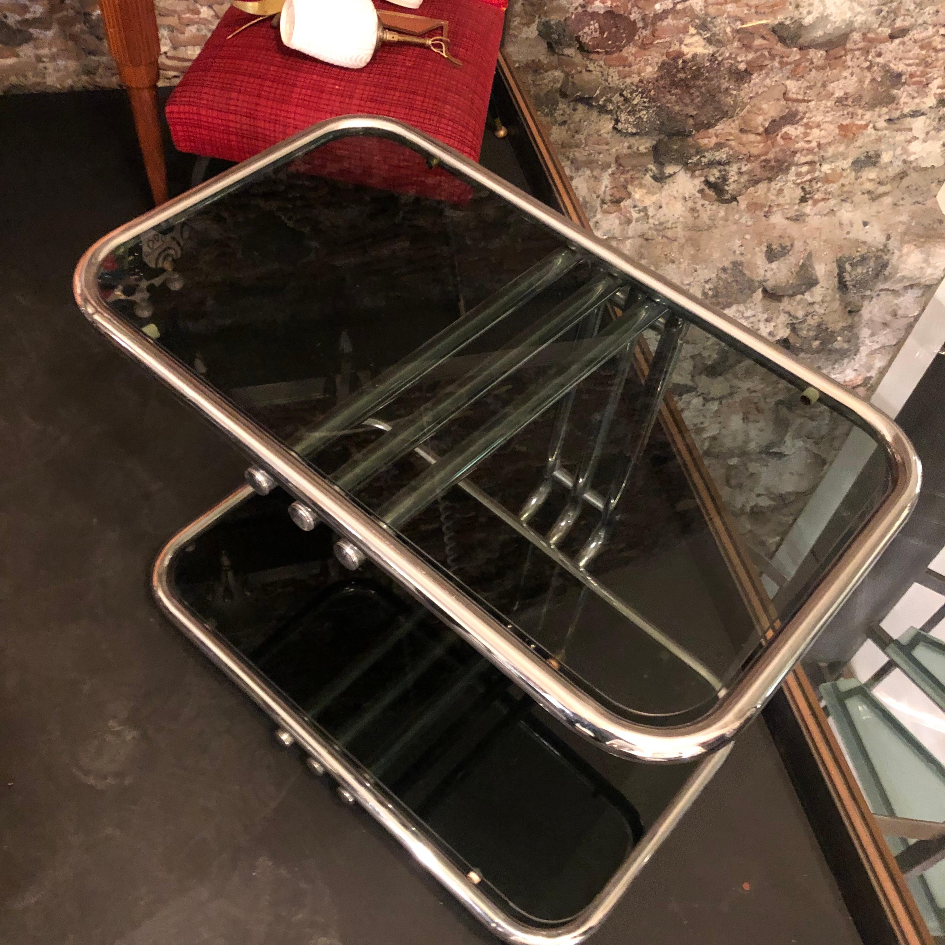 Stylish steel and glass cart made in Italy by Morex in the 1970s. It's in very good conditions.